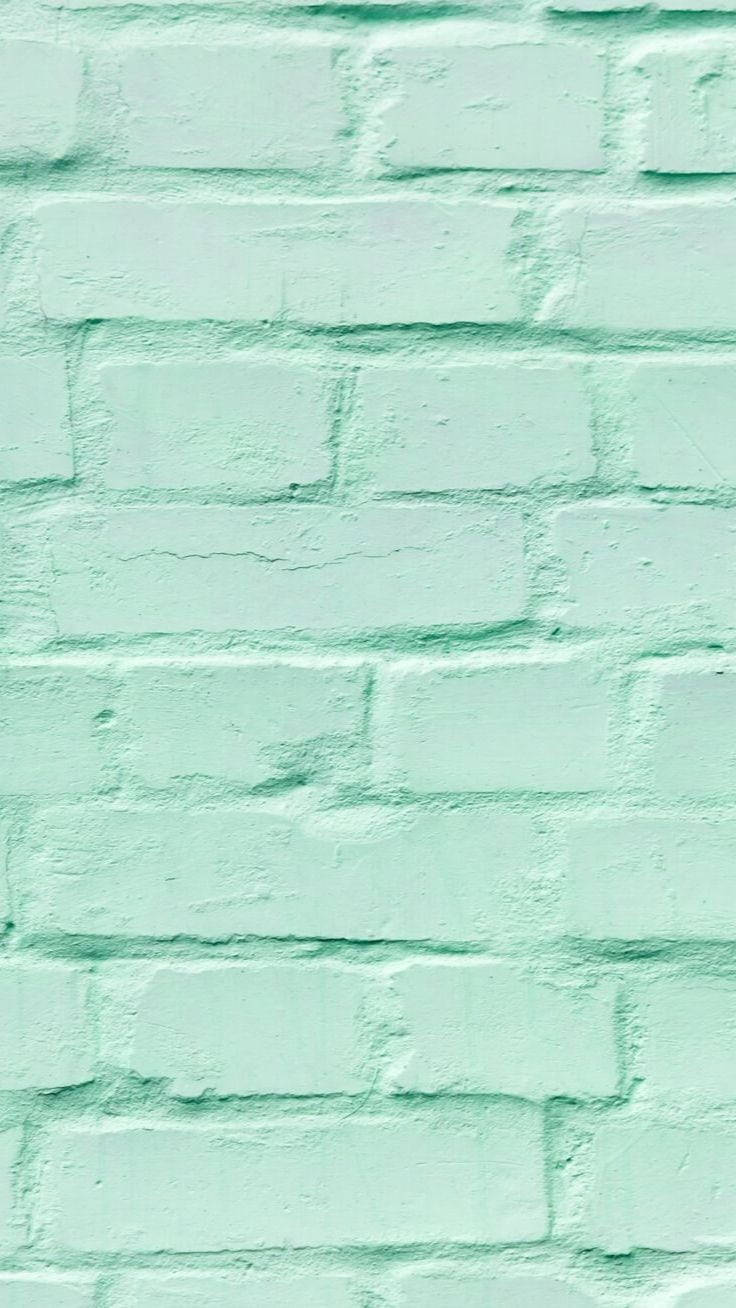Brick Wall 桌布 壁紙 — 薄荷綠色油漆磚牆的特寫，可見紋理和砂漿線。