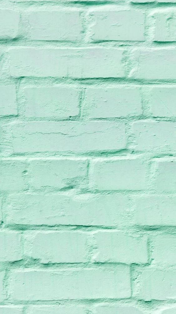 Brick Wall 桌布 壁紙 — 薄荷綠色油漆磚牆的特寫，可見紋理和砂漿線。