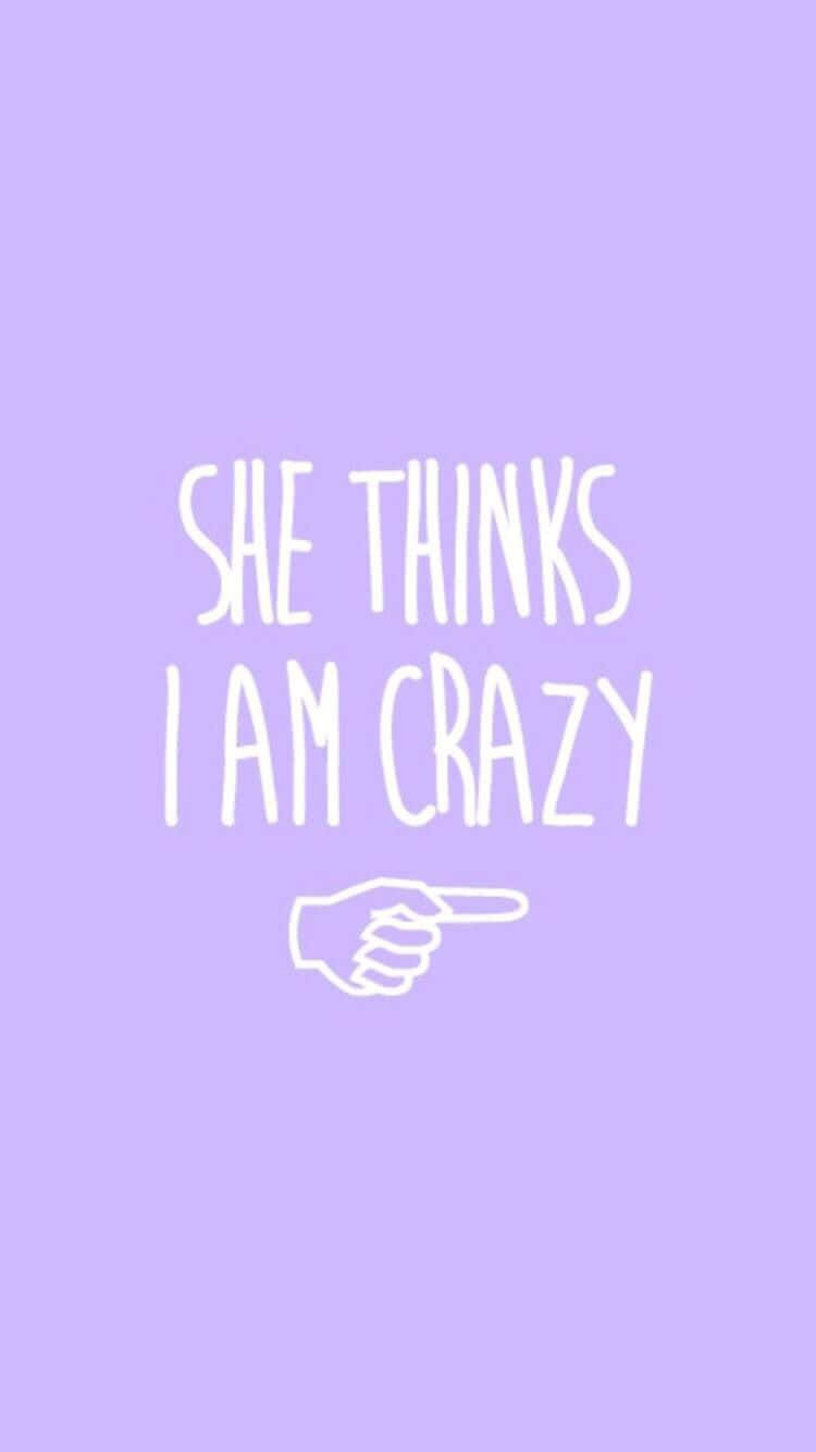 Friends iPhone 桌布 壁紙 — 薰衣草背景，白色手寫文字寫著「SHE THINKS I AM CRAZY」，下方有一隻手指指向的手。