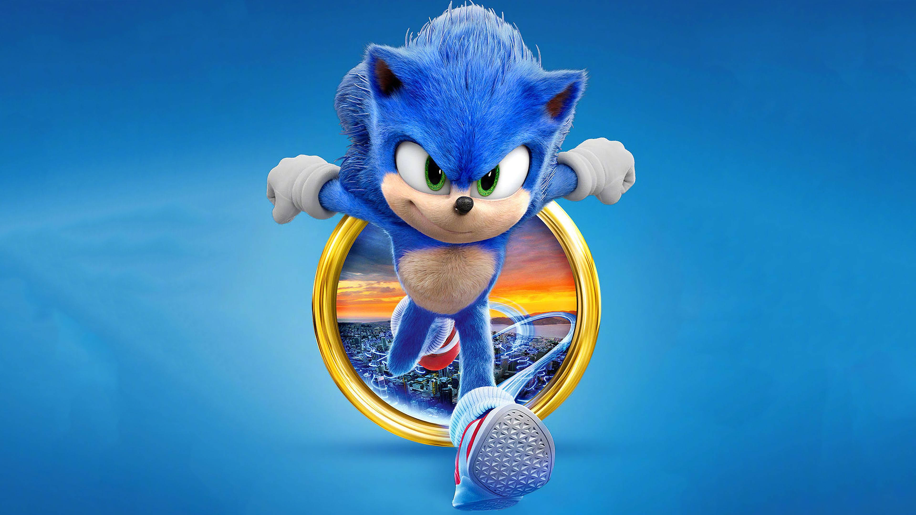 索尼克 桌布 壁紙 — 藍色刺蝟 Sonic the Hedgehog 穿過一個金色圓環，背景是充滿活力的藍色，身後可見城市日落。