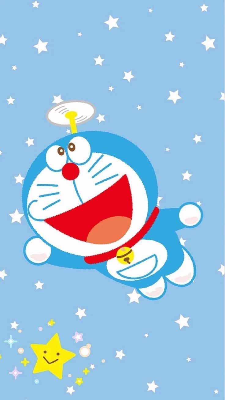 Doraemon 桌布 壁紙 — 藍色機器貓哆啦A夢愉快地漂浮在星光燦爛的淺藍色天空中，下方有一顆微笑的黃色星星。