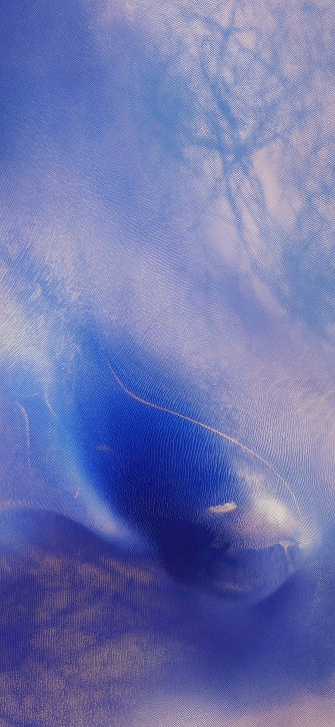 iPhone 桌布 壁紙 — 藍色紋理布料的特寫，帶有淡淡的樹枝陰影和柔和的光線圖案。