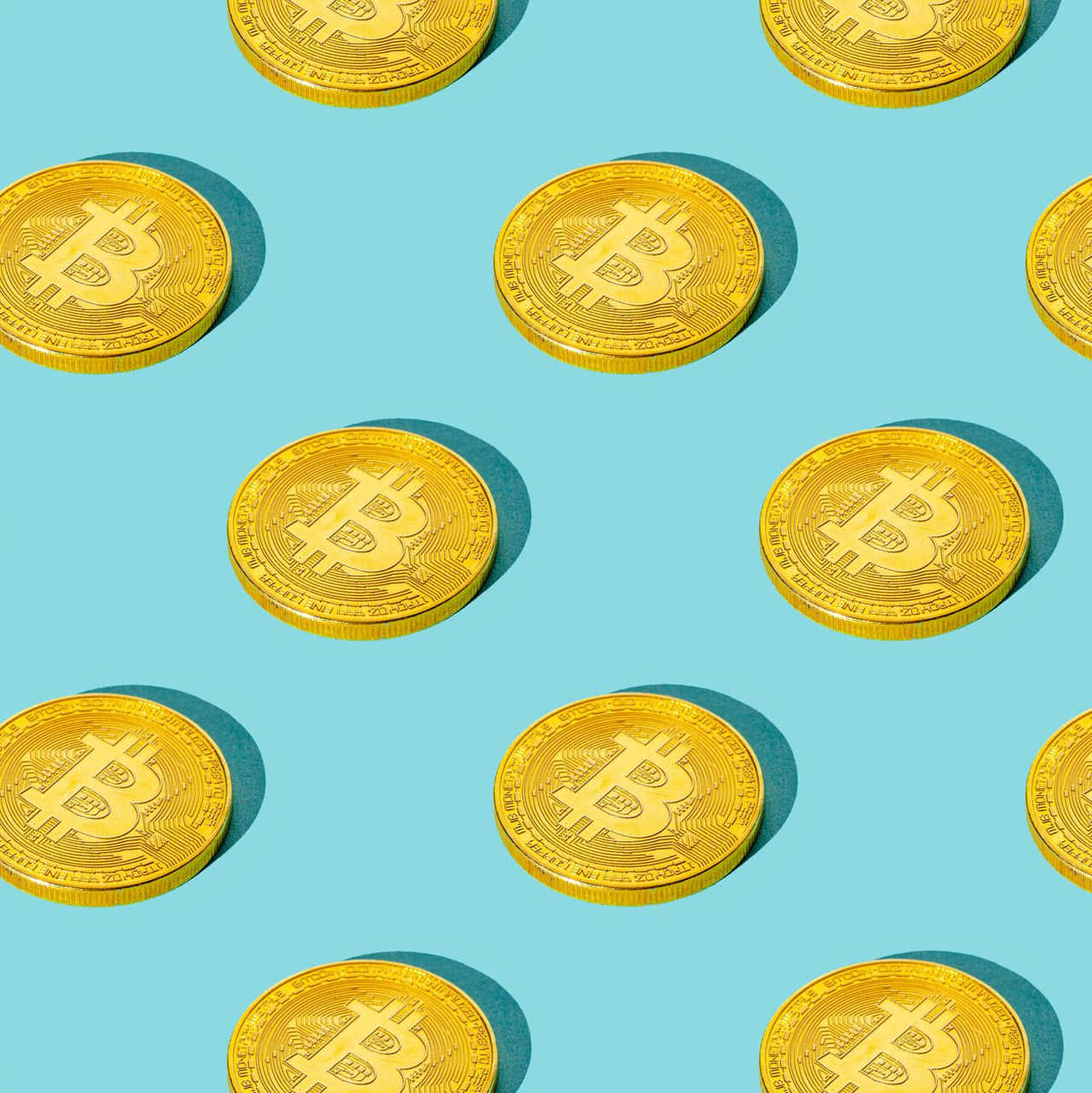 藍色背景上的金色比特幣圖案 壁紙