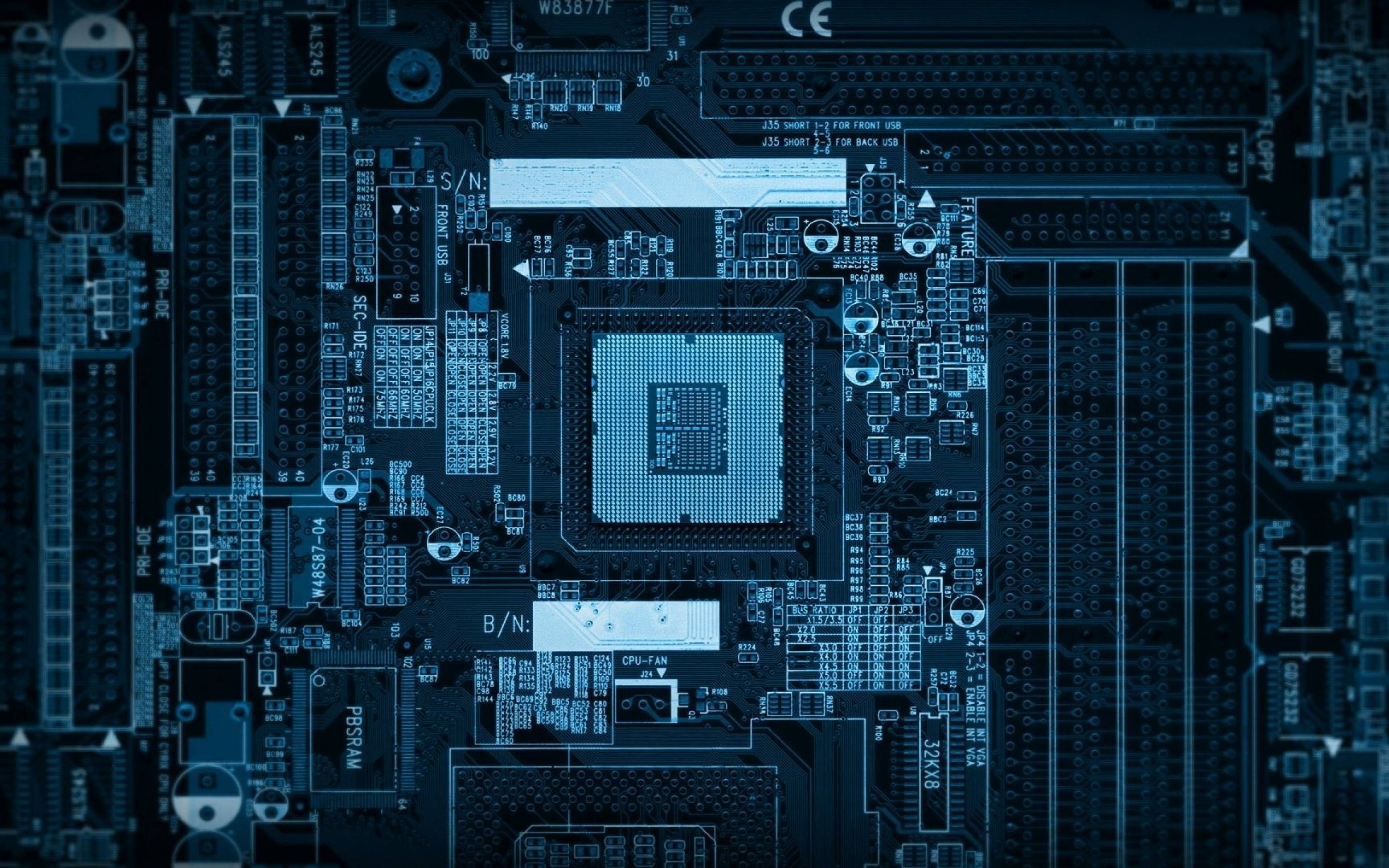 Motherboard 桌布 壁紙 — 藍色調電腦主機板特寫，細節豐富，中央有CPU和複雜電路。