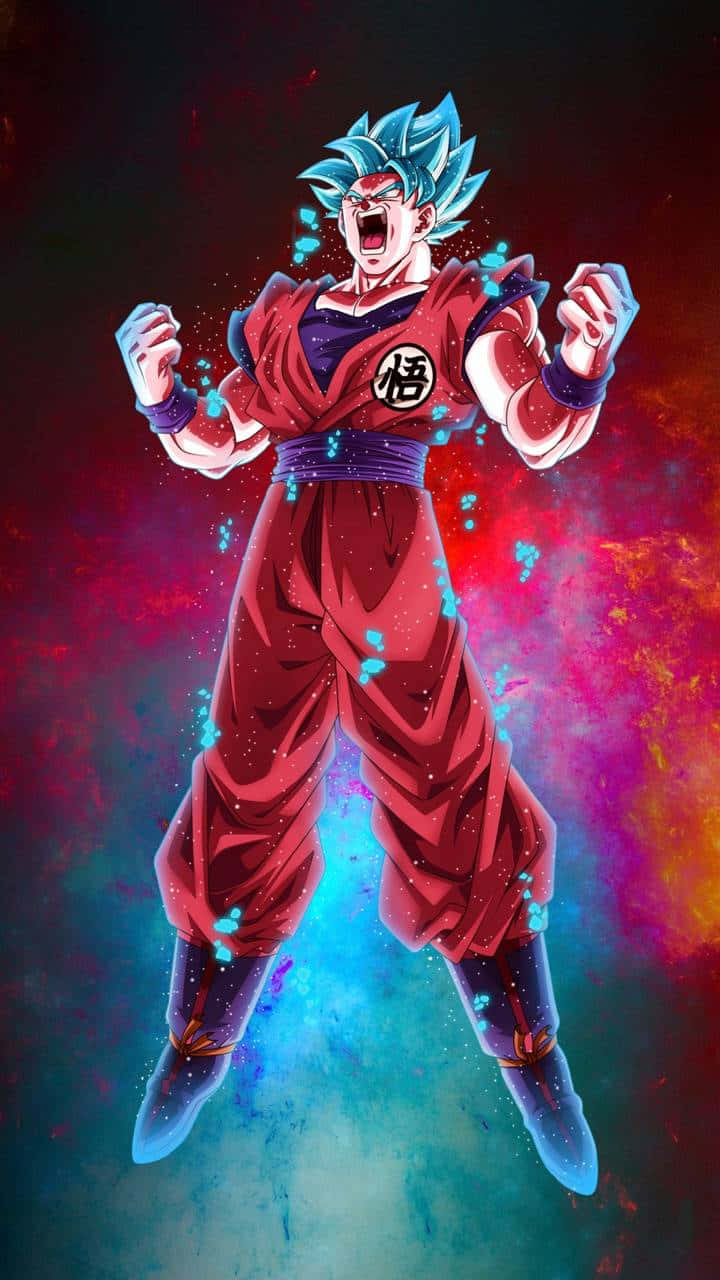 Goku Kaioken 桌布 壁紙 — 藍髮超級賽亞人神悟空身穿紅色道服，在宇宙紅藍星雲背景下，發光拳頭咆哮。