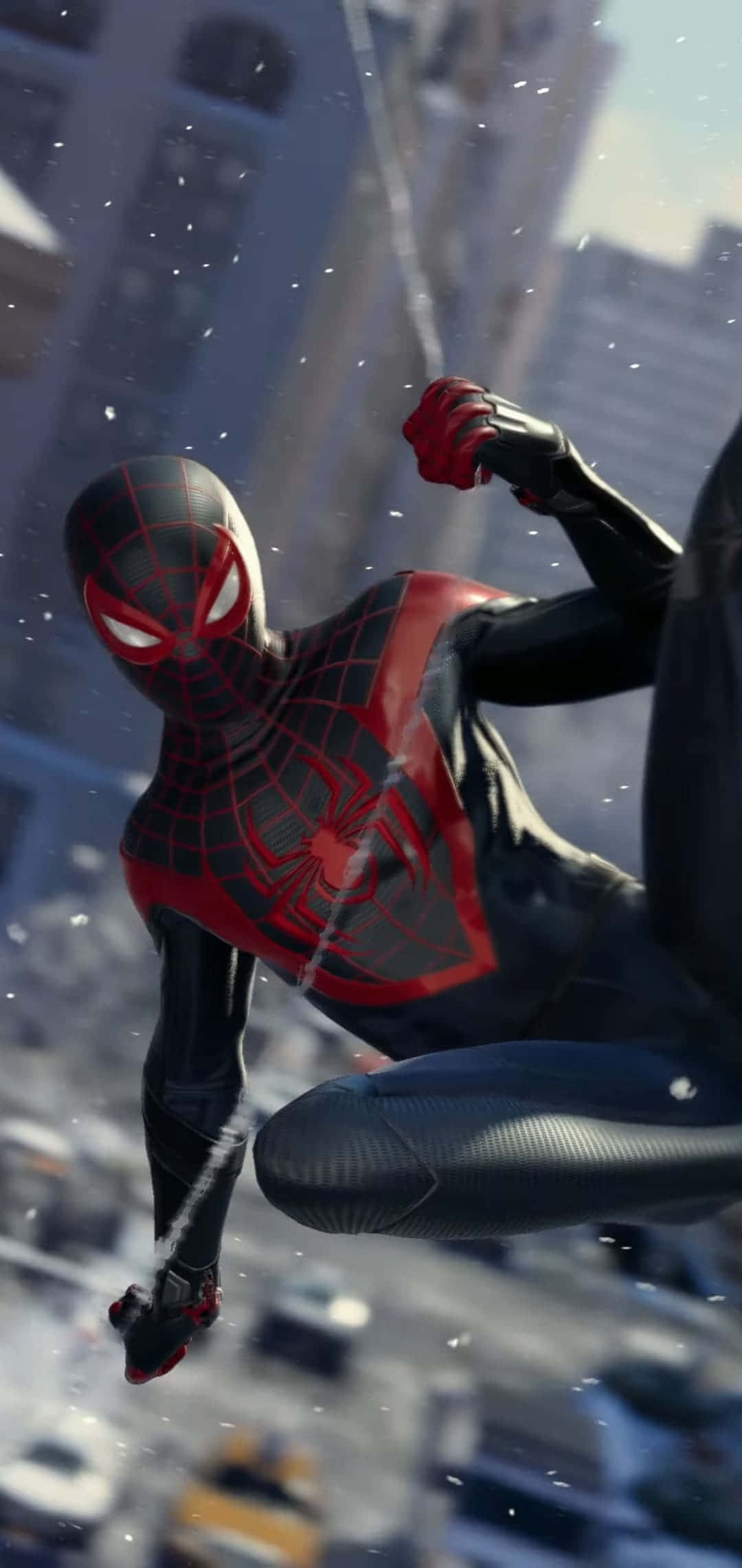 Miles Morales iPhone 桌布 壁紙 — 蜘蛛人穿著黑色和紅色戰衣，在雪花飄落的模糊城市景觀中動態擺盪。