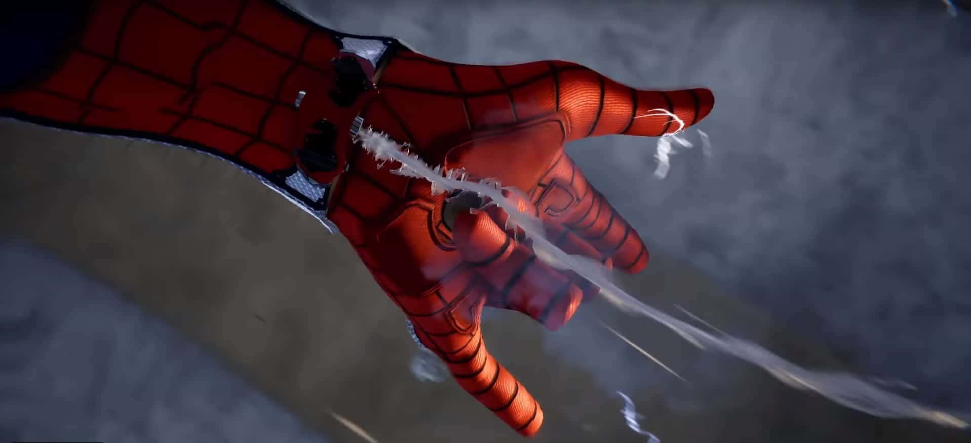 Spider-man Web Shooter 桌布 壁紙 — 蜘蛛人紅藍手套的手部特寫，在煙霧灰色背景前發射蜘蛛絲。