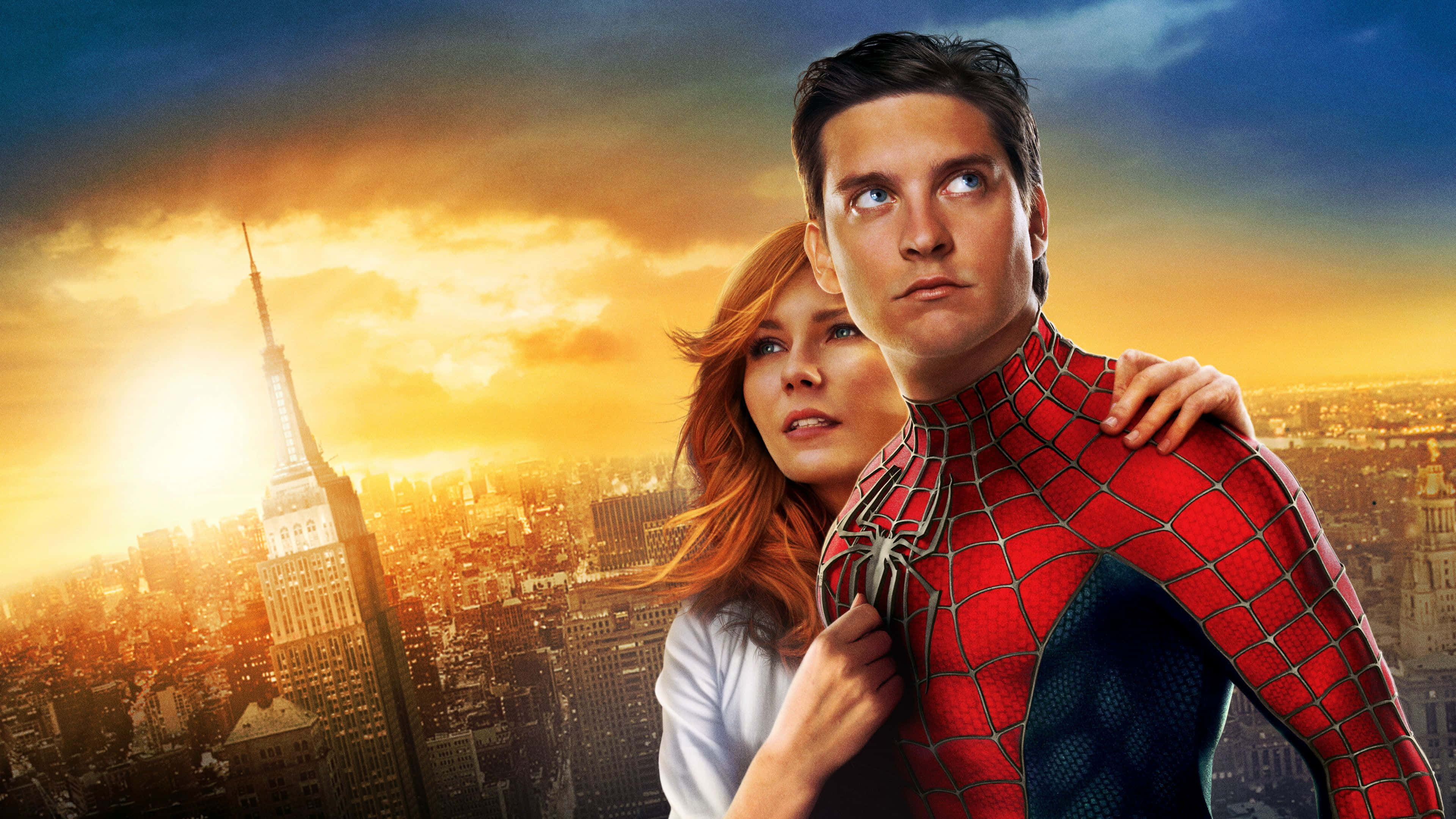 Spider Man 3 桌布 壁紙 — 蜘蛛人與關·史黛西在紐約市的金色日落背景下並肩而立，帝國大廈清晰可見。