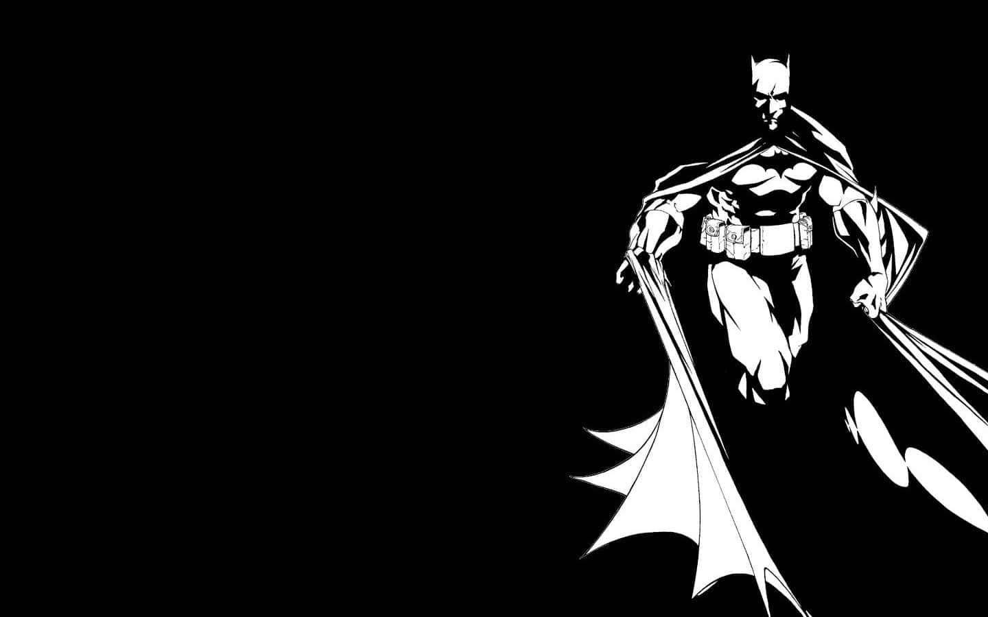 Batman Black And White 桌布 壁紙 — 蝙蝠俠以鮮明的黑白剪影站在黑暗背景前，斗篷動態飄逸。