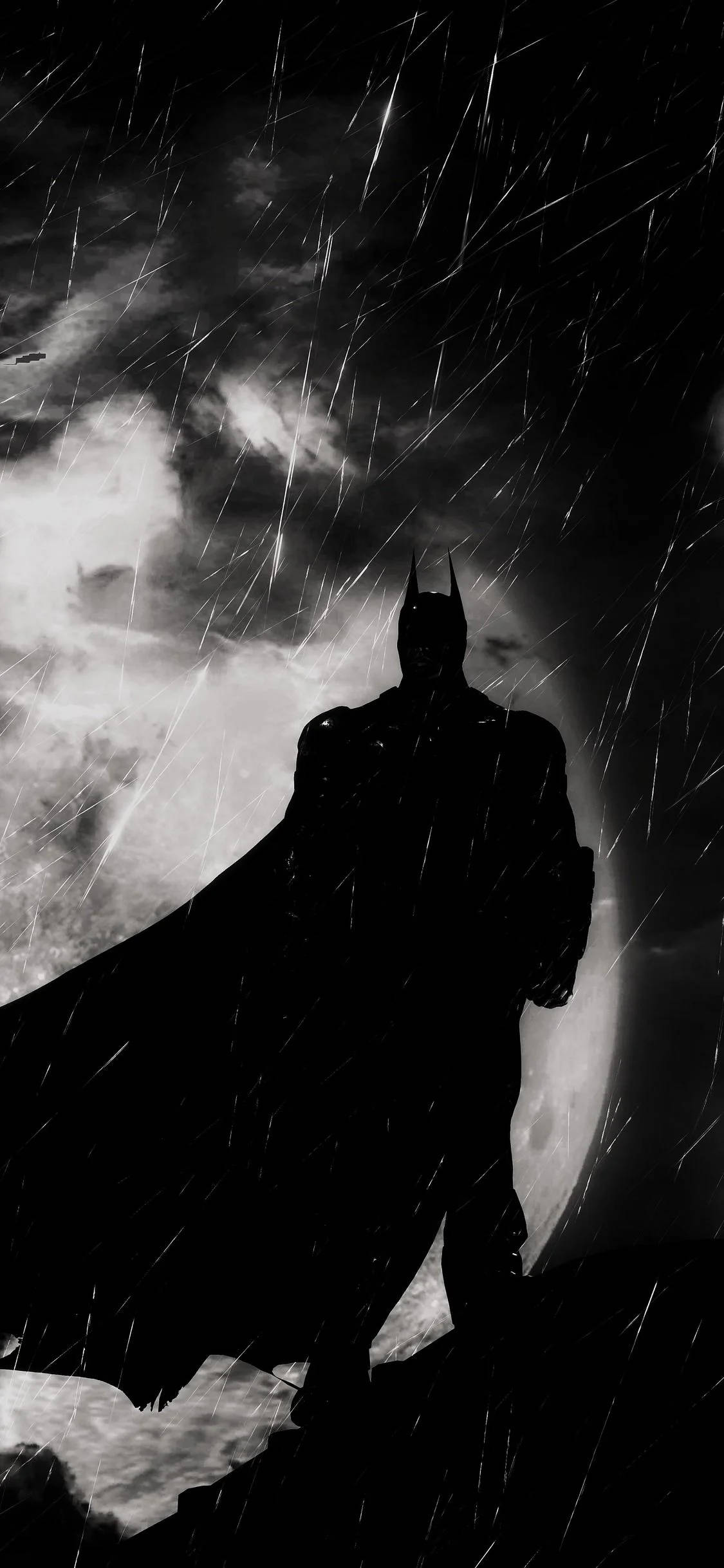 batman arkham city iPhone 桌布 壁紙 — 蝙蝠俠以黑暗剪影姿態站立，背景是暴風雨的天空，帶有雨絲和發光的月亮。