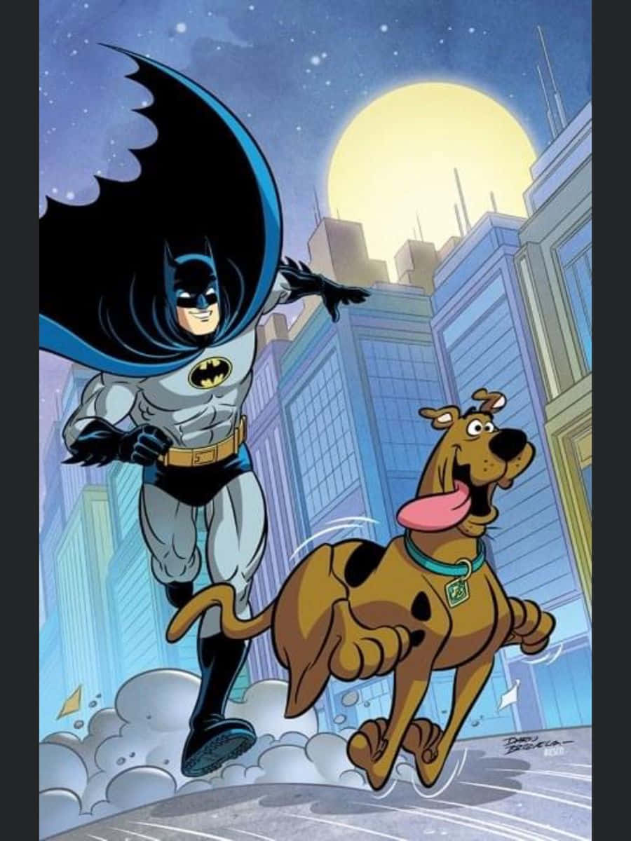 Batman The Brave And The Bold 桌布 壁紙 — 蝙蝠俠和史酷比在月光下的城市景觀中跳躍，蝙蝠俠的斗篷飄揚，史酷比的舌頭伸出來。