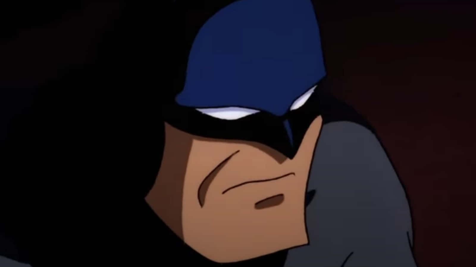 Batman Animated Adventures 桌布 壁紙 — 蝙蝠俠嚴肅的臉在陰影黑暗中凝視，散發著發光的白色眼睛和陰沉的表情。