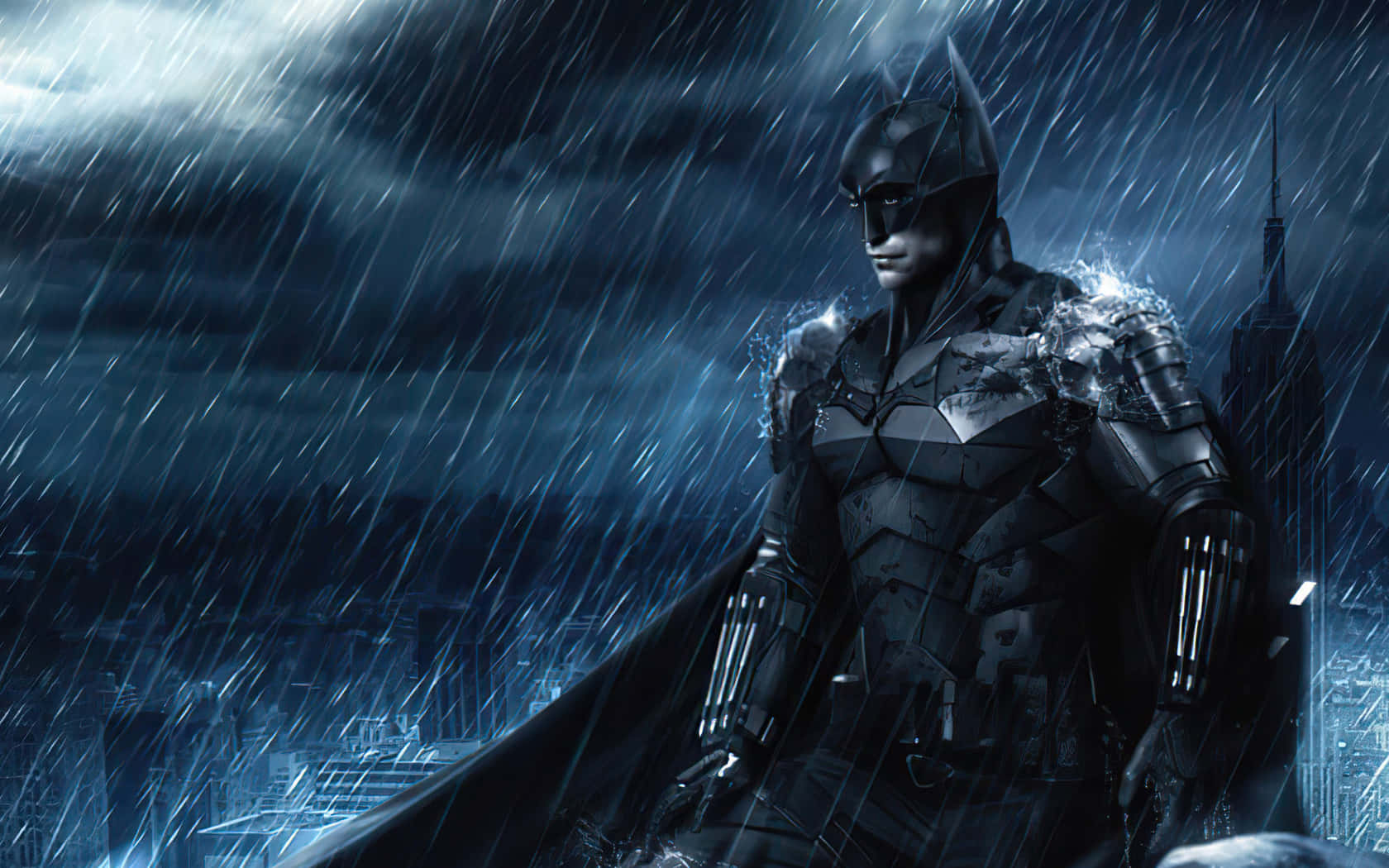 Batman Desktop 桌布 壁紙 — 蝙蝠俠在暴雨中的高譚市景觀中堅定站立，暴風雨夜空下閃電照亮了他的裝甲輪廓。
