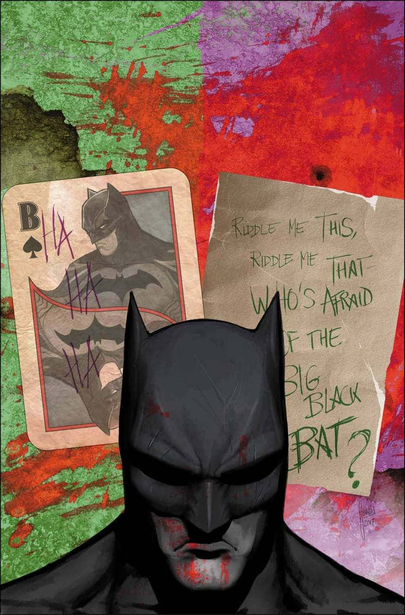 Batman Reborn 桌布 壁紙 — 蝙蝠俠從一張破爛的撲克牌和謎語便條中陰沉地凝視著，背景是濺滿綠色、紅色和紫色的污漬。