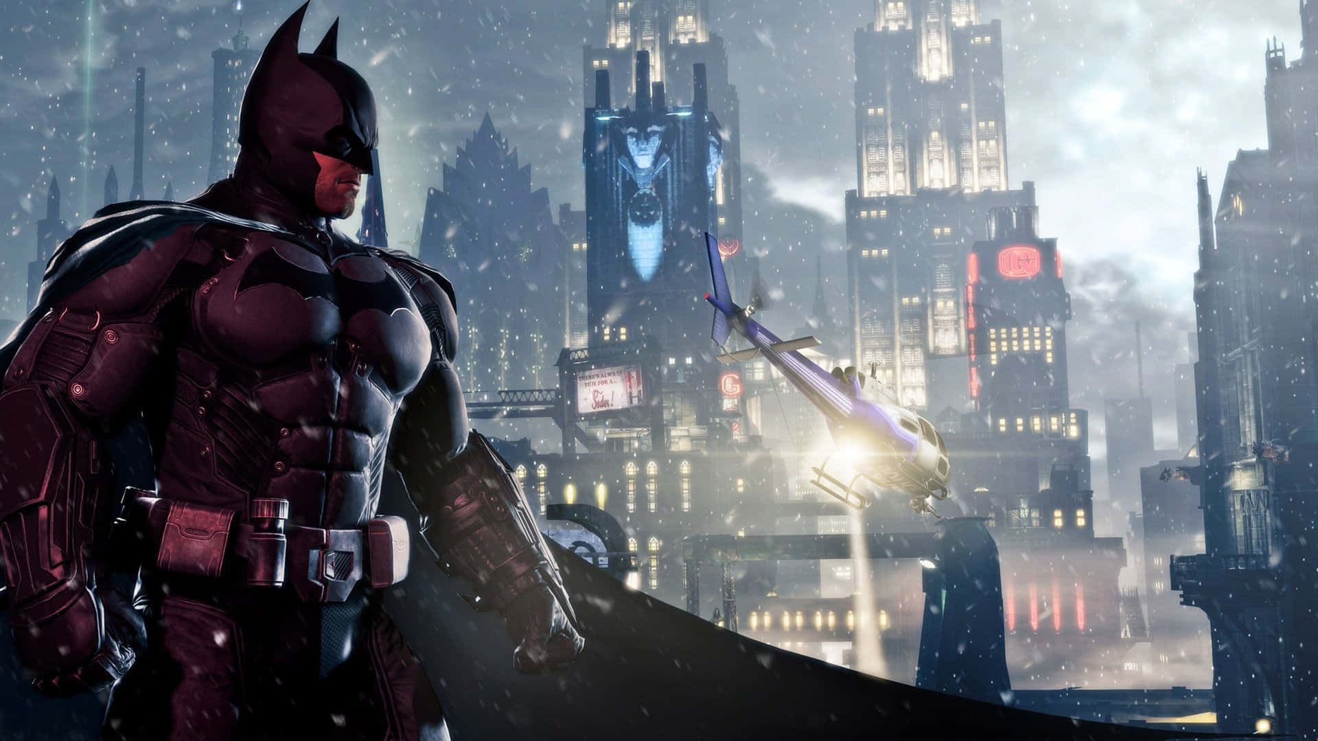 Batman Arkham Origins 桌布 壁紙 — 蝙蝠俠站在夜晚積雪的葛咸城，一架直升機飛過高聳明亮的建築物。