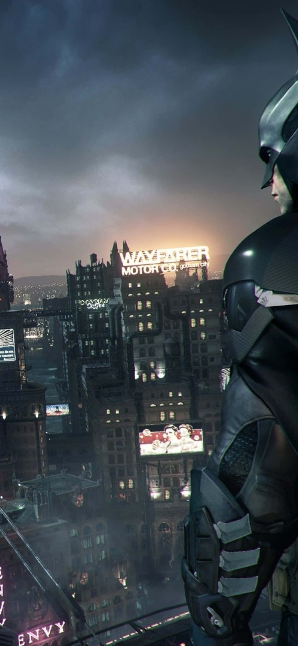 iPhone Xs Max Batman Arkham City 桌布 壁紙 — 蝙蝠俠站在屋頂上，俯瞰黃昏時霓虹燈閃爍的高譚市景，遠處的「Wayfarer Motor Co」招牌閃閃發光。