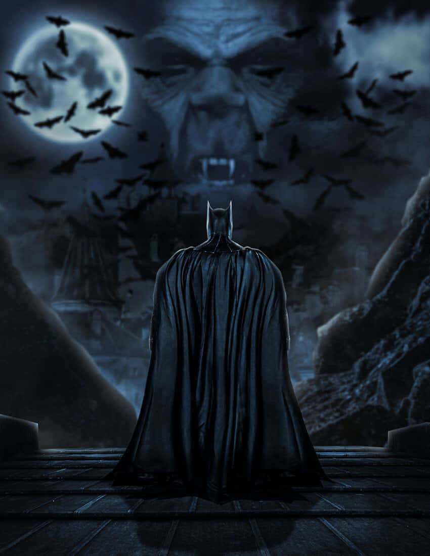 The Batman Vs Dracula 桌布 壁紙 — 蝙蝠俠站在屋頂上，在滿月下面對一個巨大的蝙蝠狀面孔，蝙蝠在夜空中成群飛舞。