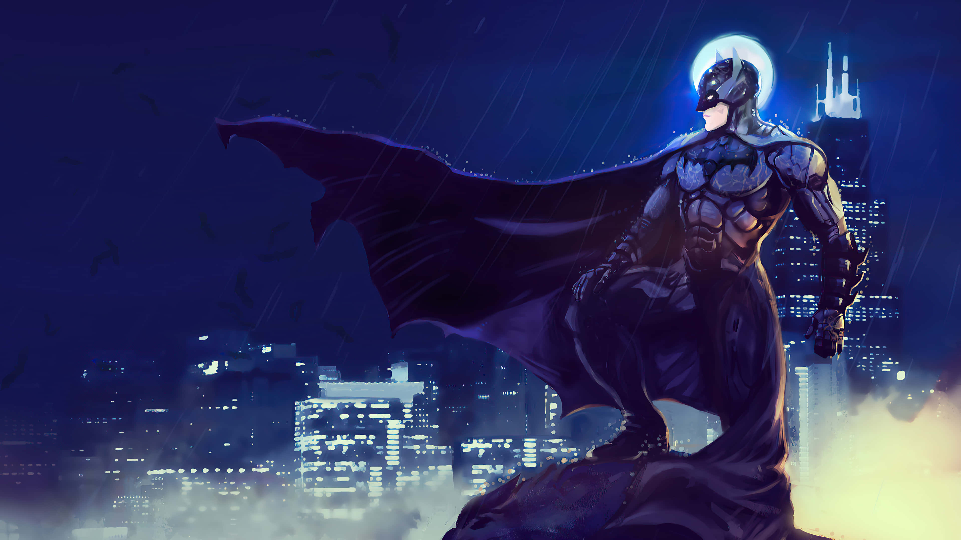 Batman City 桌布 壁紙 — 蝙蝠俠站在滿月下濕滑的高譚市屋頂上，斗篷隨風飄揚，城市燈光在下方閃爍。