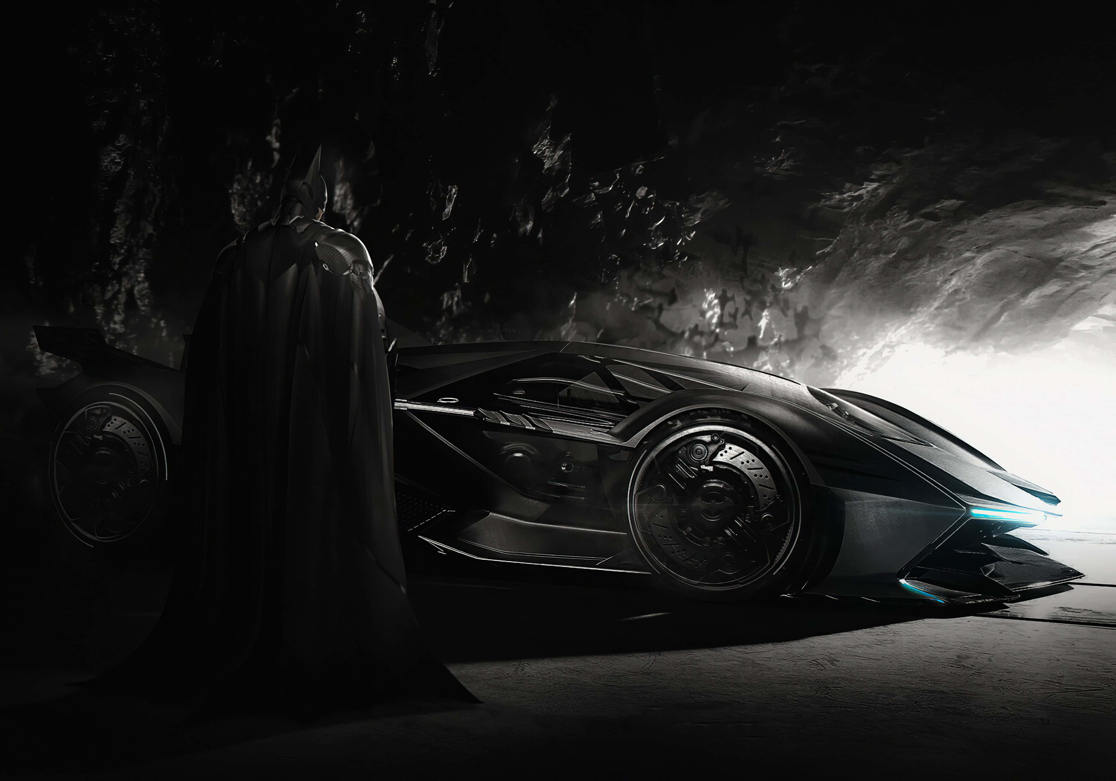 4K Batmobile 桌布 壁紙 — 蝙蝠俠站在陰影中，旁邊是他時尚的裝甲蝙蝠車，位於一個洞穴般的地下巢穴，由戲劇性的背光照明。