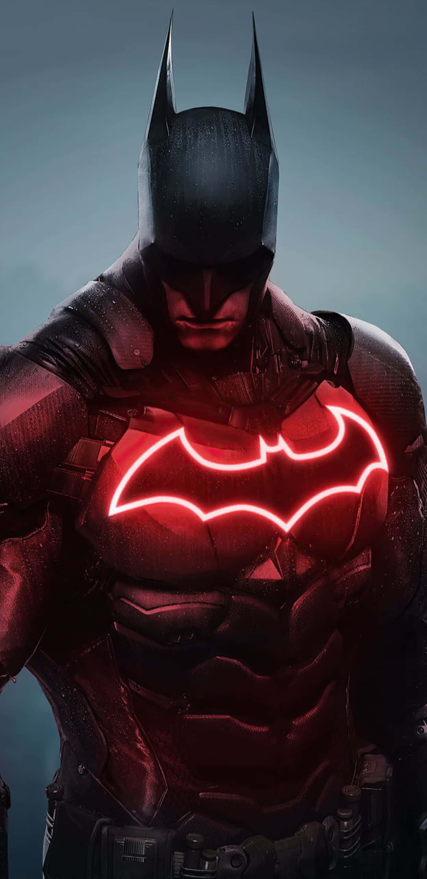 Pixel 3xl Batman Arkham City 桌布 壁紙 — 蝙蝠俠站在陰影中，發光的紅色蝙蝠標誌照亮了他裝甲胸膛，背景為深灰色。