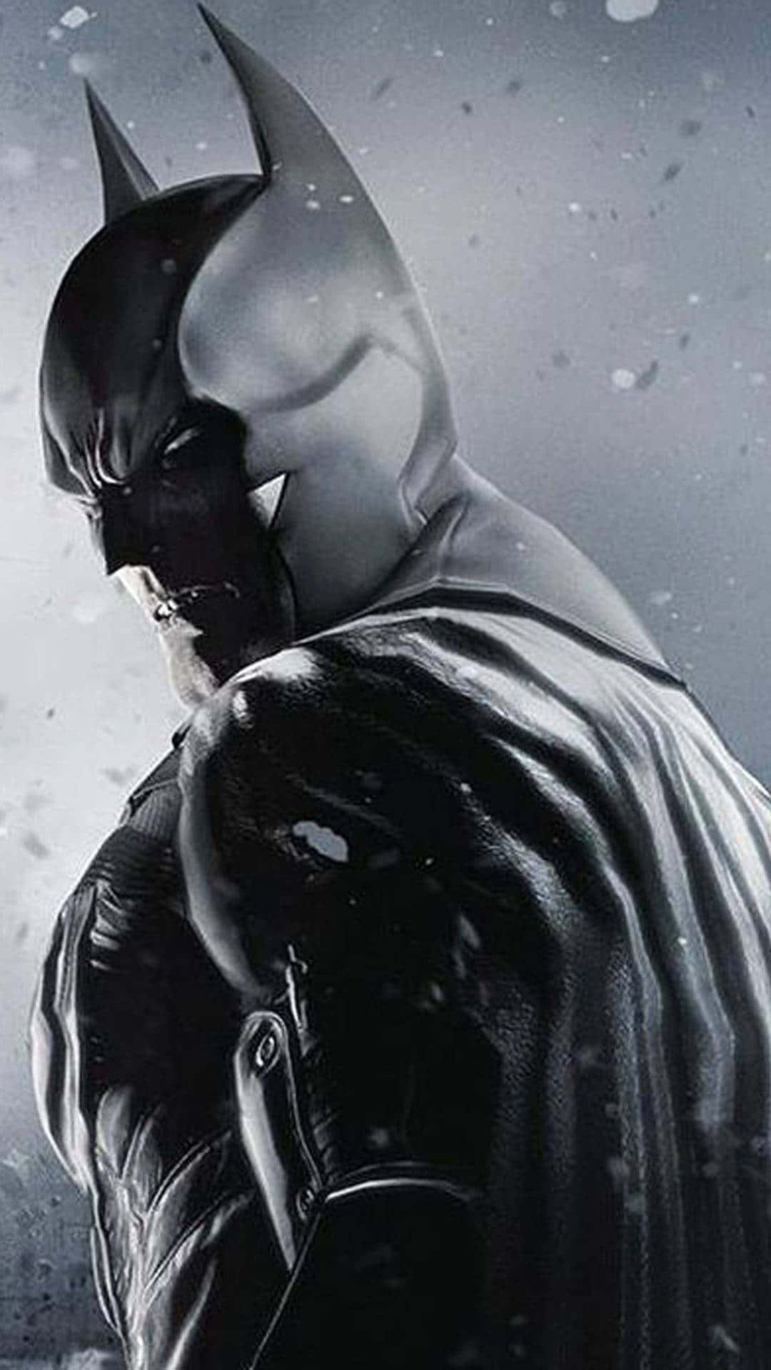 Awesome Batman 桌布 壁紙 — 蝙蝠俠站在雪景城市場景中，他的斗篷隨風飄揚，雪花在他陰沉而堅定的臉龐周圍飄舞。