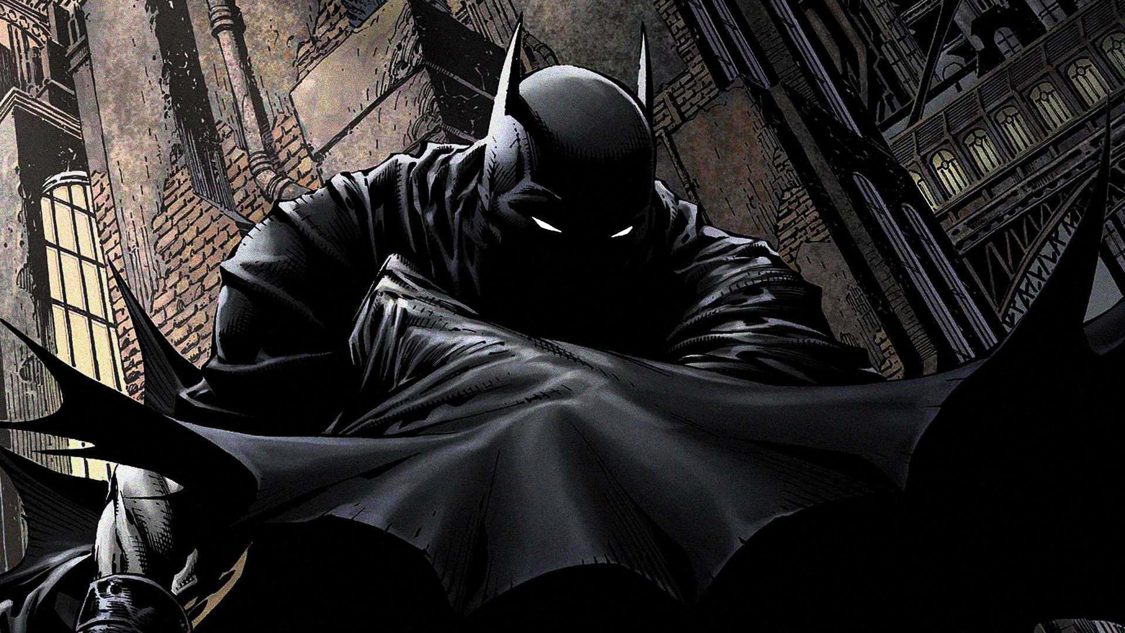Awesome Batman 桌布 壁紙 — 蝙蝠俠站在黑暗的高譚市小巷中，斗篷飄揚，眼睛發出白光，映襯著粗糙的磚造建築。