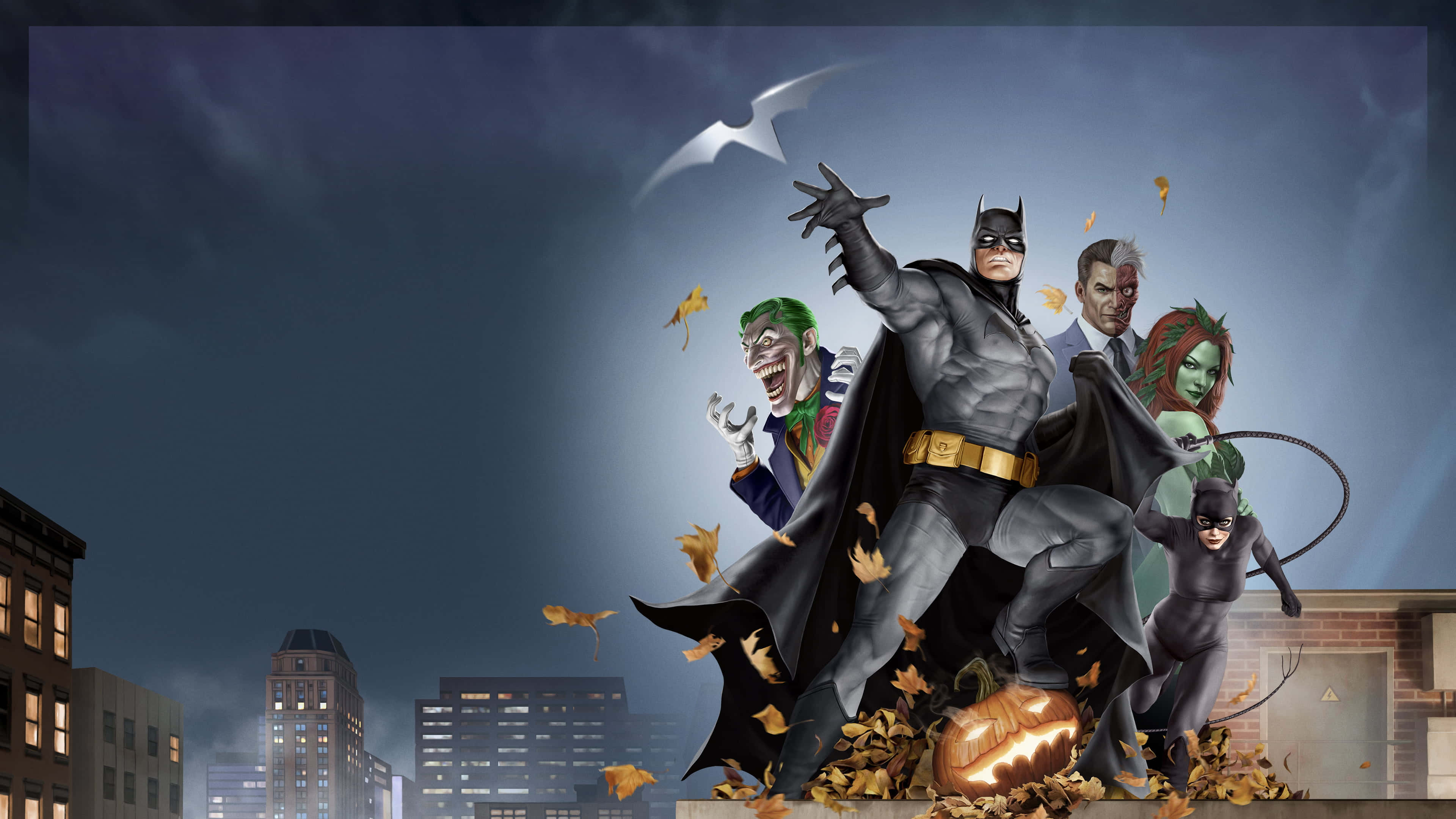 Batman The Long Halloween 桌布 壁紙 — 蝙蝠俠與盟友在黑暗的城市天際線背景下，挑釁地站在南瓜上，周圍是飄落的秋葉。