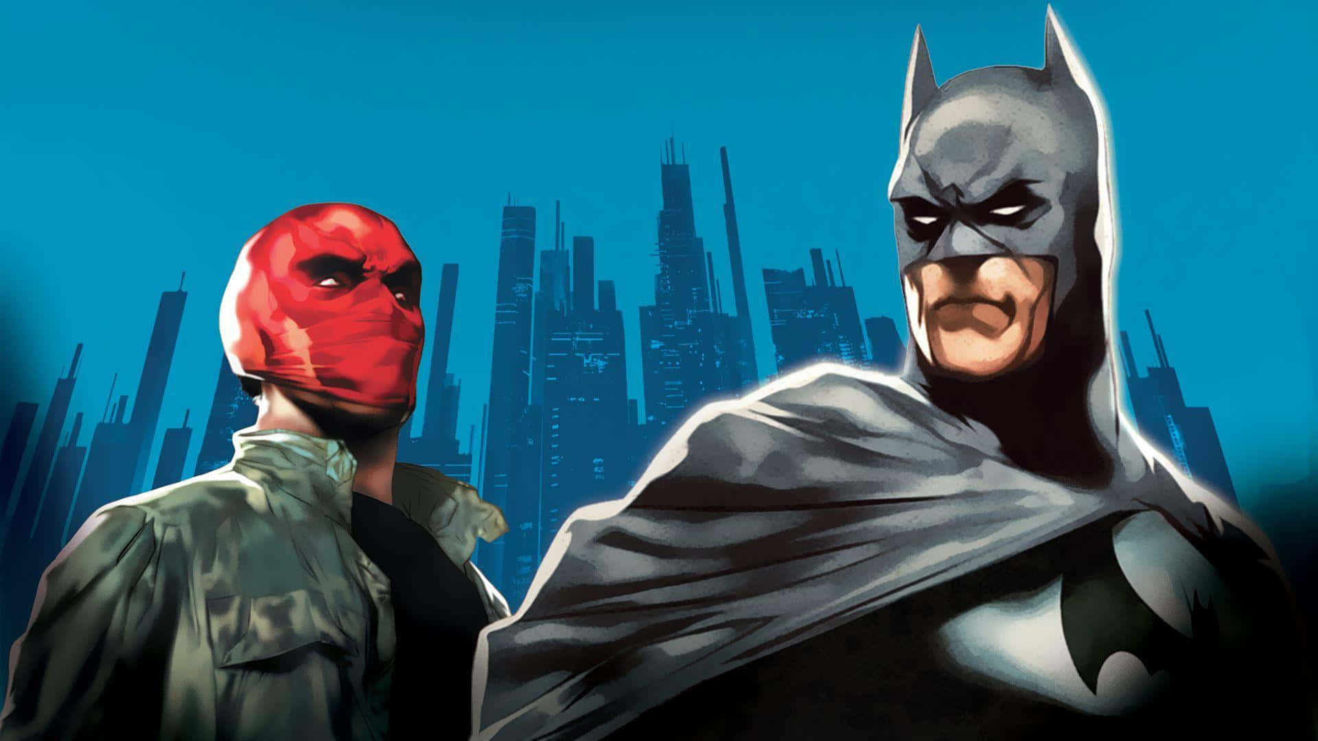 Batman Under The Red Hood 桌布 壁紙 — 蝙蝠俠與紅頭罩並肩而立，背景是深藍色的城市天際線和高聳入雲的摩天大樓。