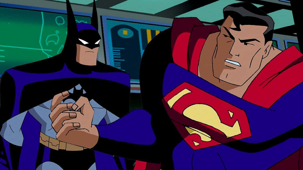 Superman The Animated Series 桌布 壁紙 — 蝙蝠俠與超人在緊張的動畫場景中對峙，背後有發光的綠色螢幕。