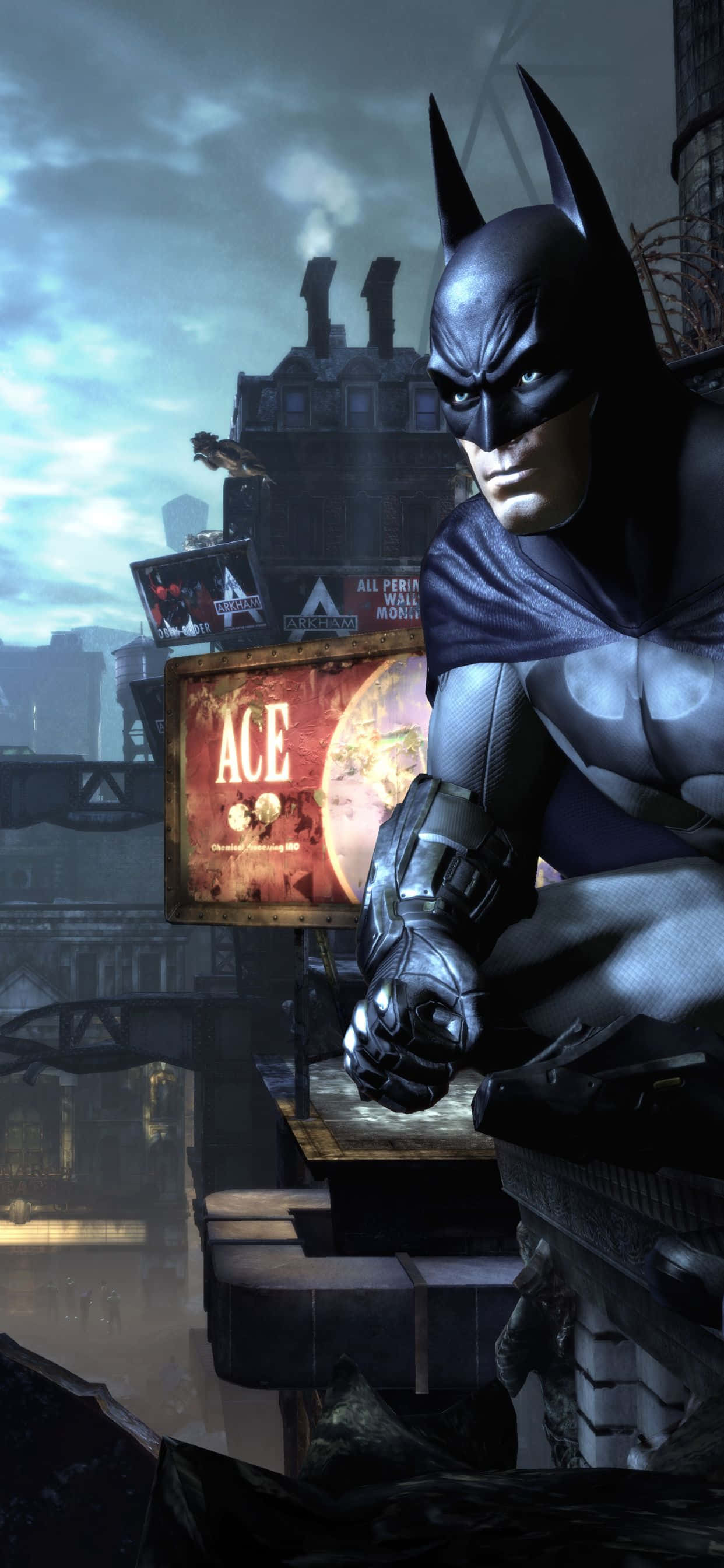 iPhone Xs Max Batman Arkham City 桌布 壁紙 — 蝙蝠俠蹲在屋頂上，俯瞰著陰沉的高譚市天際線，天空多雲。