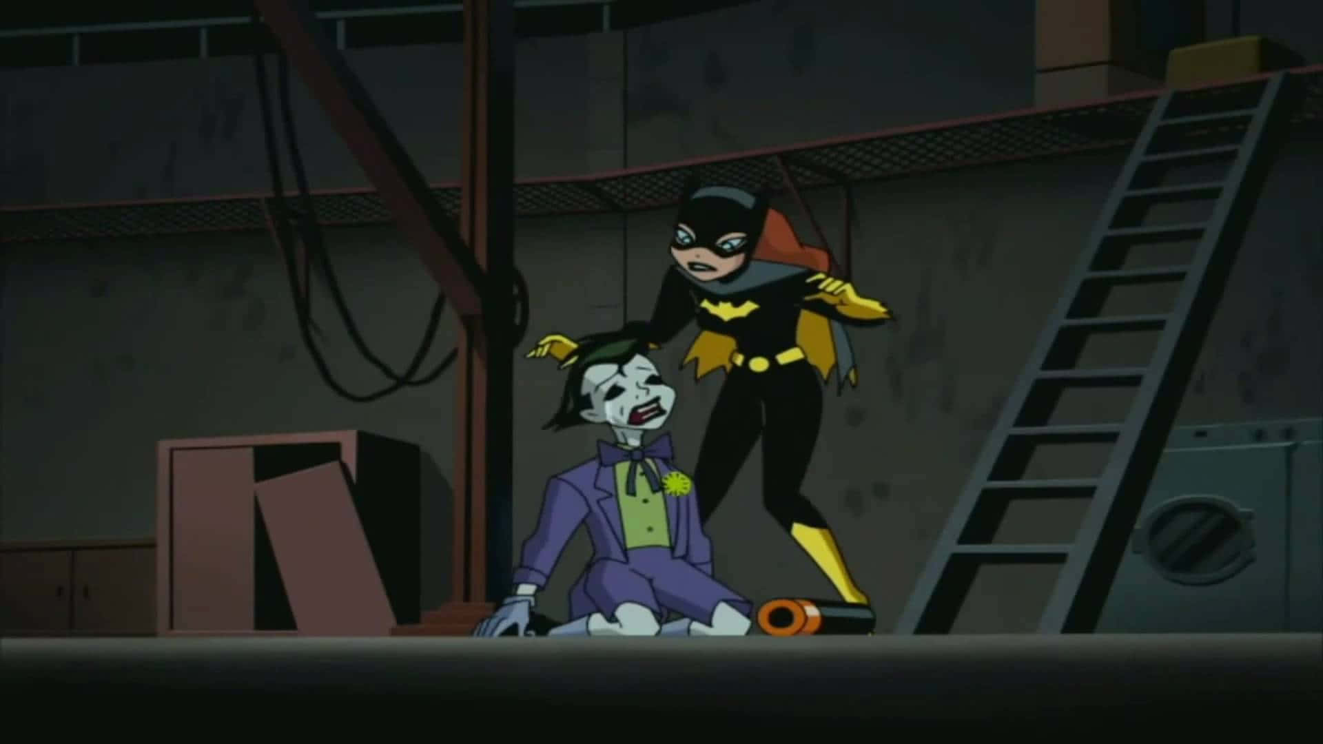 Batman Beyond Return Of The Joker 桌布 壁紙 — 蝙蝠女站在陰暗的工業倉庫中，梯子和管道之間，勝利地俯視著跪在地上的小丑。