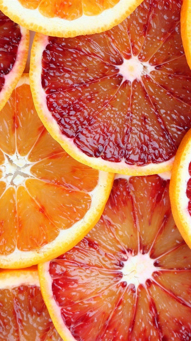 Fruit 桌布 壁紙 — 血橙和普通橙片重疊的鮮豔特寫，展現多汁果肉和紋理果皮。