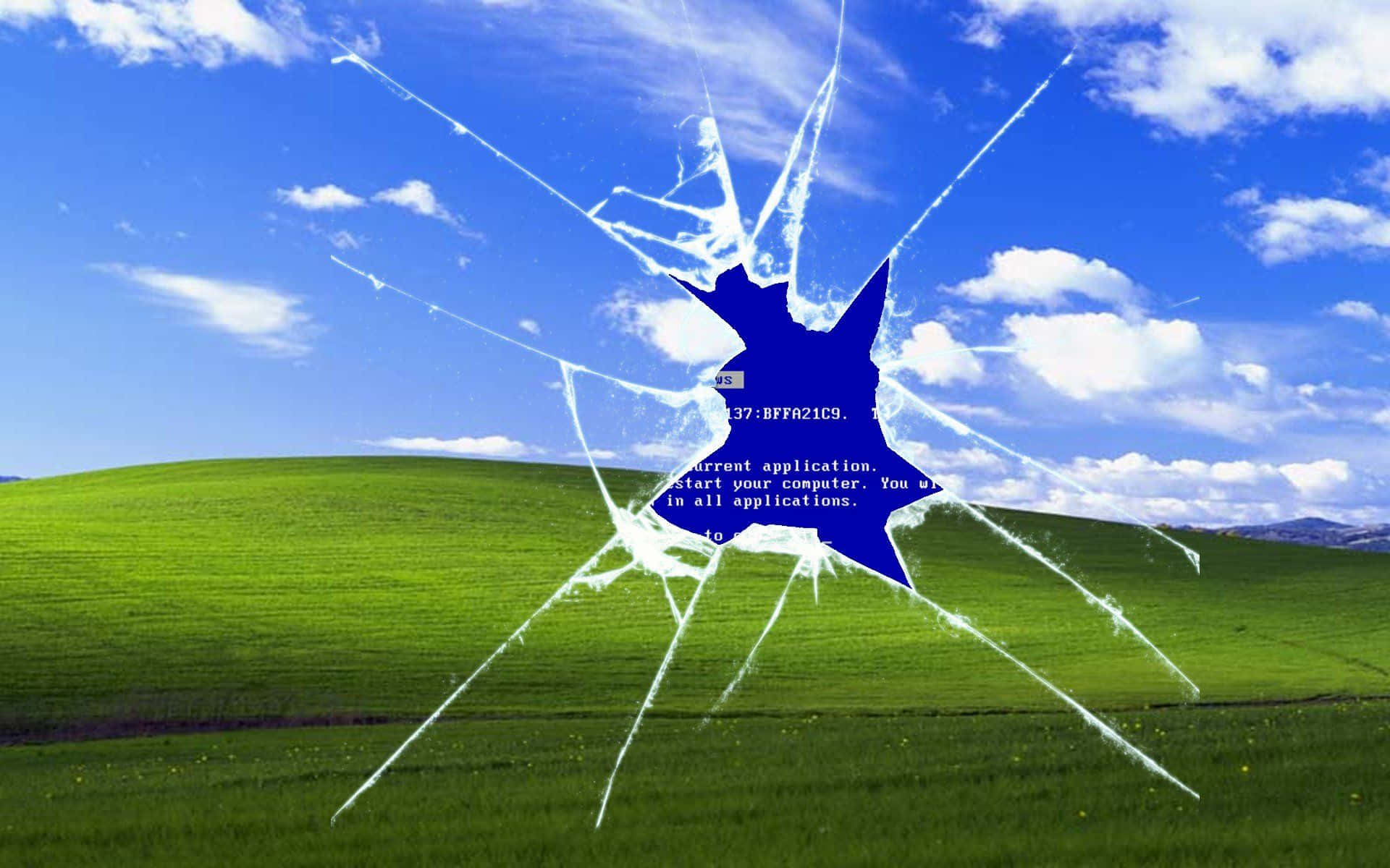 Windows XP 桌布 壁紙 — 裂紋玻璃效果覆蓋在明亮的藍天下綠色起伏山丘上的經典Windows XP藍屏錯誤。