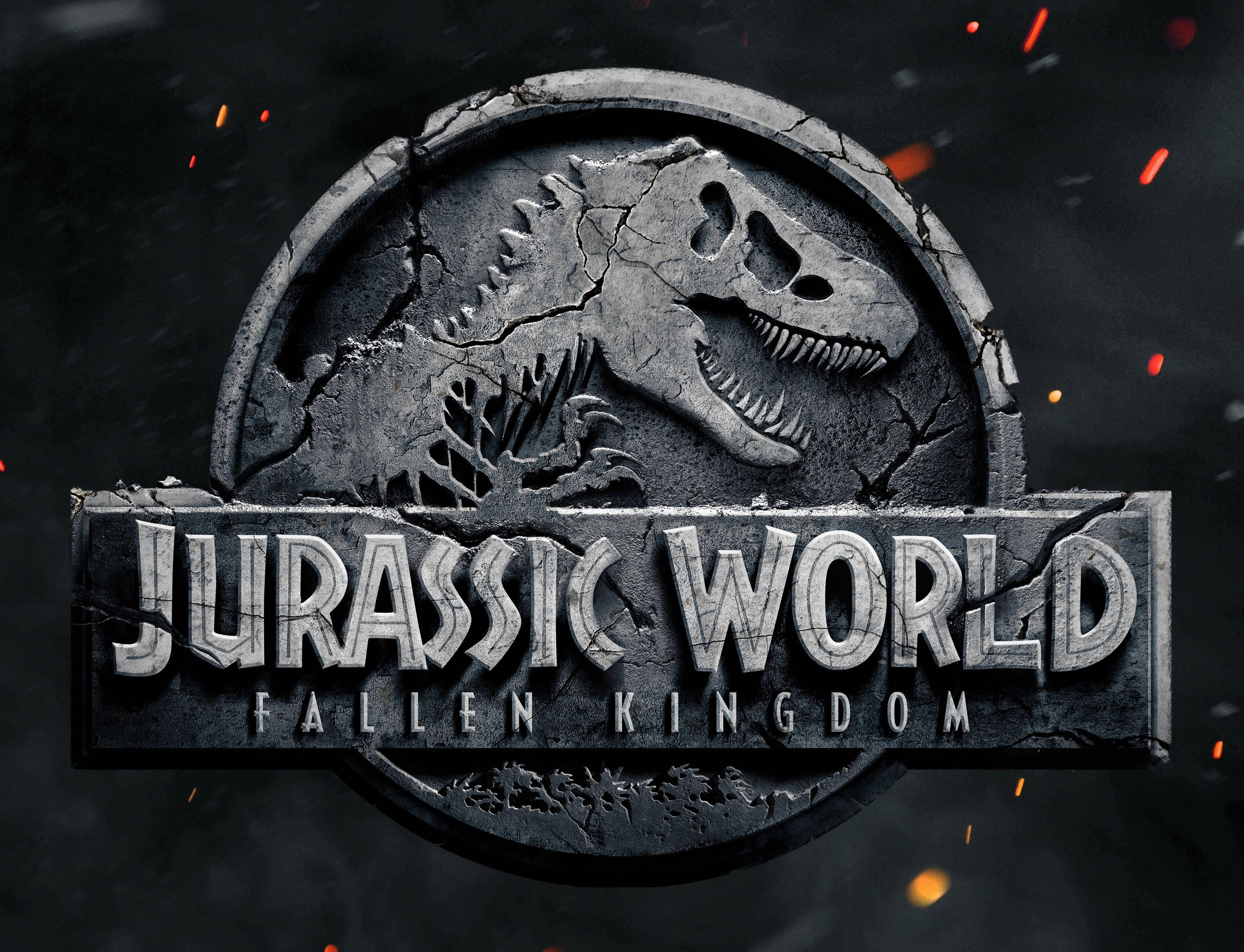 侏羅紀公園 桌布 壁紙 — 裂開的石頭 Jurassic World 標誌，咆哮的暴龍頭和火花在黑暗背景上。