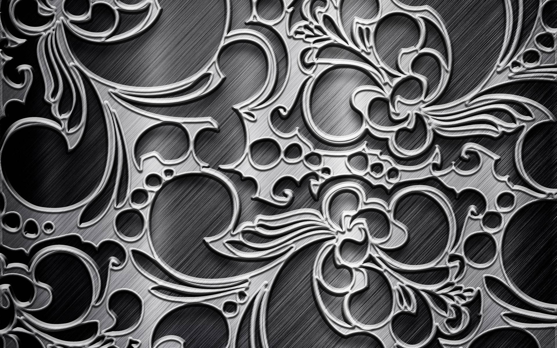 metal 桌布 壁紙 — 複雜的金屬花卉圖案，帶有拉絲銀和黑色漸變，營造出奢華華麗的質感。