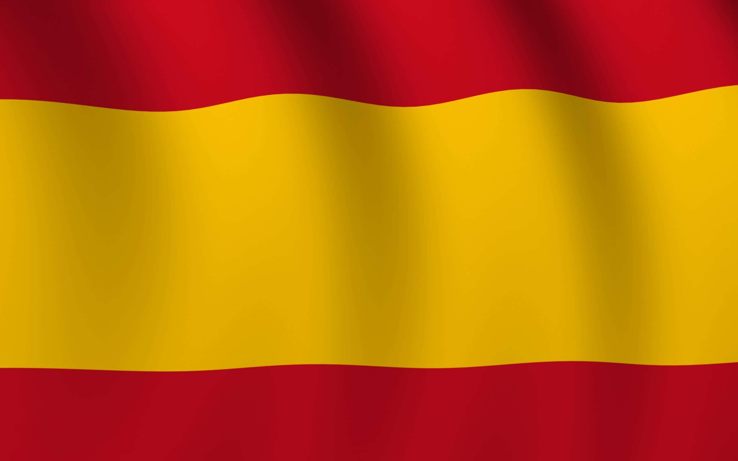 Spanish 桌布 壁紙 — 西班牙國旗動態飄揚，大膽的紅色和金色條紋捕捉光線。