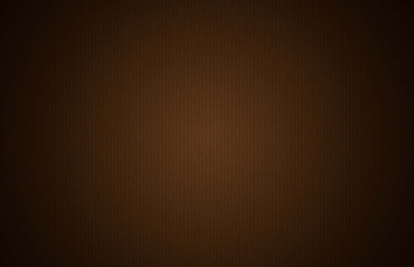 Dark Brown 桌布 壁紙 — 豐富棕色的平滑漸變，帶有微妙的垂直紋理，從深色邊緣漸變到溫暖的中心。