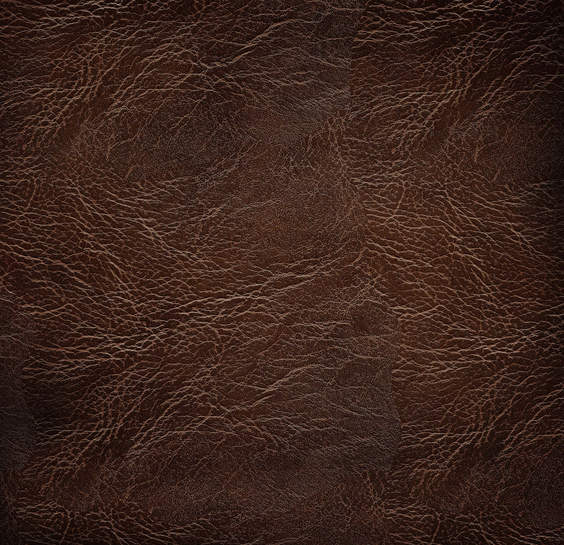 Leather 桌布 壁紙 — 豐富棕色皮革的特寫，具有複雜的自然紋理圖案和微妙的質感變化。