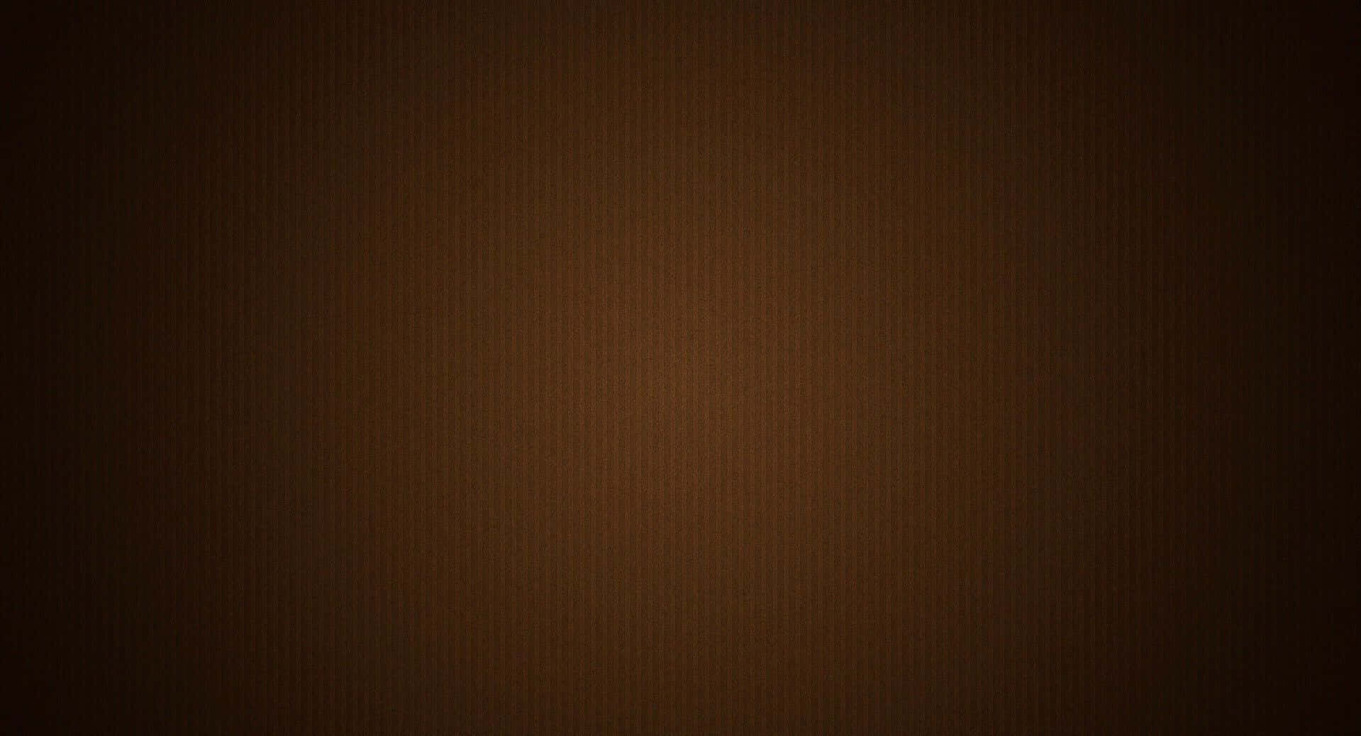 Brown Texture 桌布 壁紙 — 豐富棕色調的平滑漸變，帶有微妙的垂直紋理，從深色邊緣漸變到溫暖的中心。