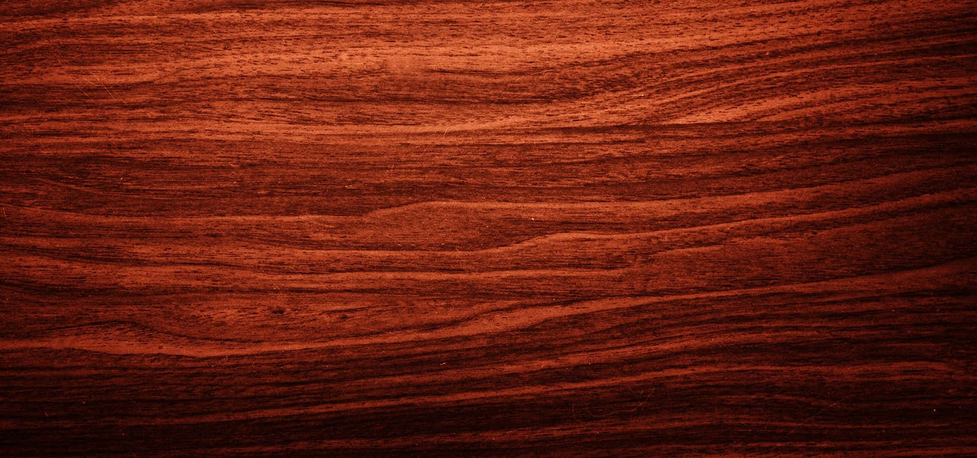 Mahogany 桌布 壁紙 — 豐富深紅色木紋質感，帶有流暢的自然圖案和溫暖的環境光線。