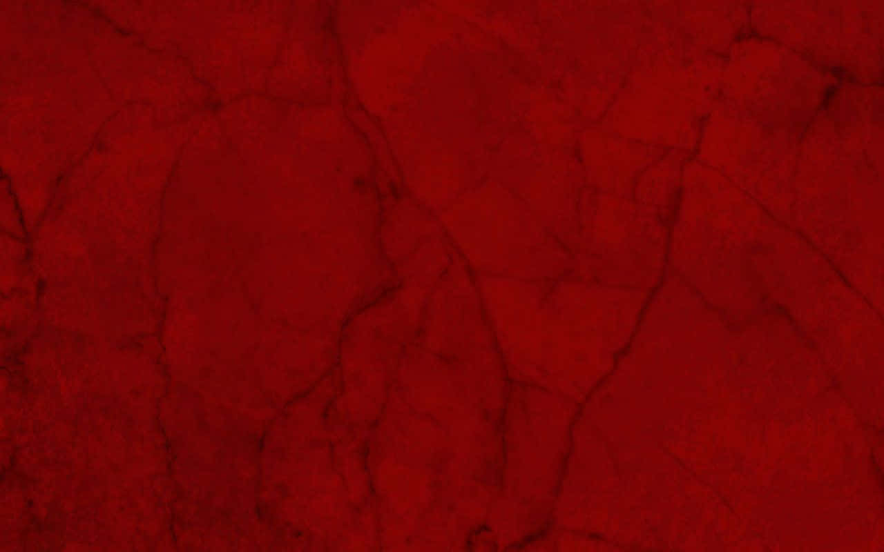 Red Marble 桌布 壁紙 — 豐富深紅色表面帶有深色紋理，類似裂紋大理石或乾涸的血跡。