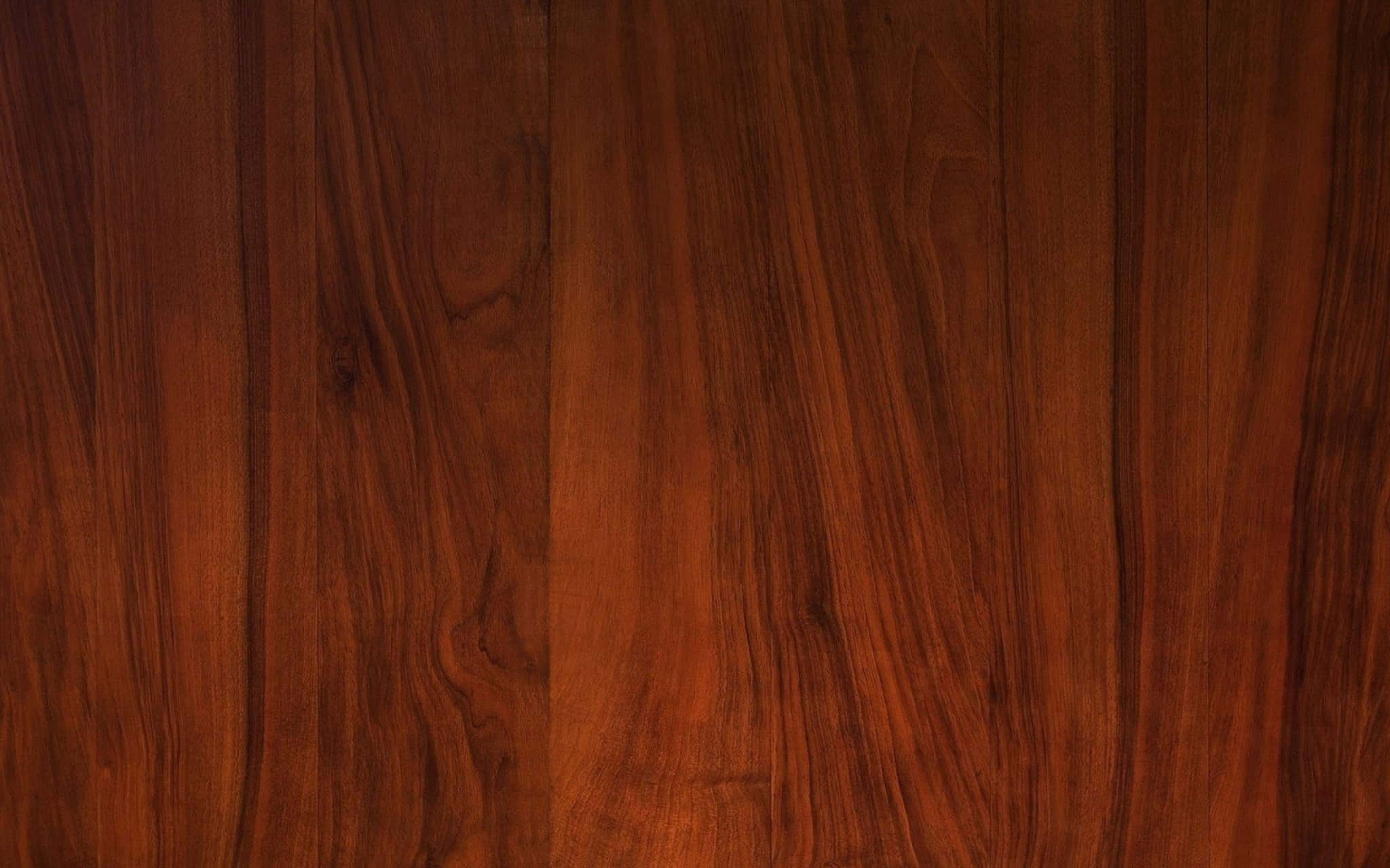 High Resolution Wood 桌布 壁紙 — 豐富溫暖的棕色木紋紋理，帶有自然流動的圖案和細微的節疤。