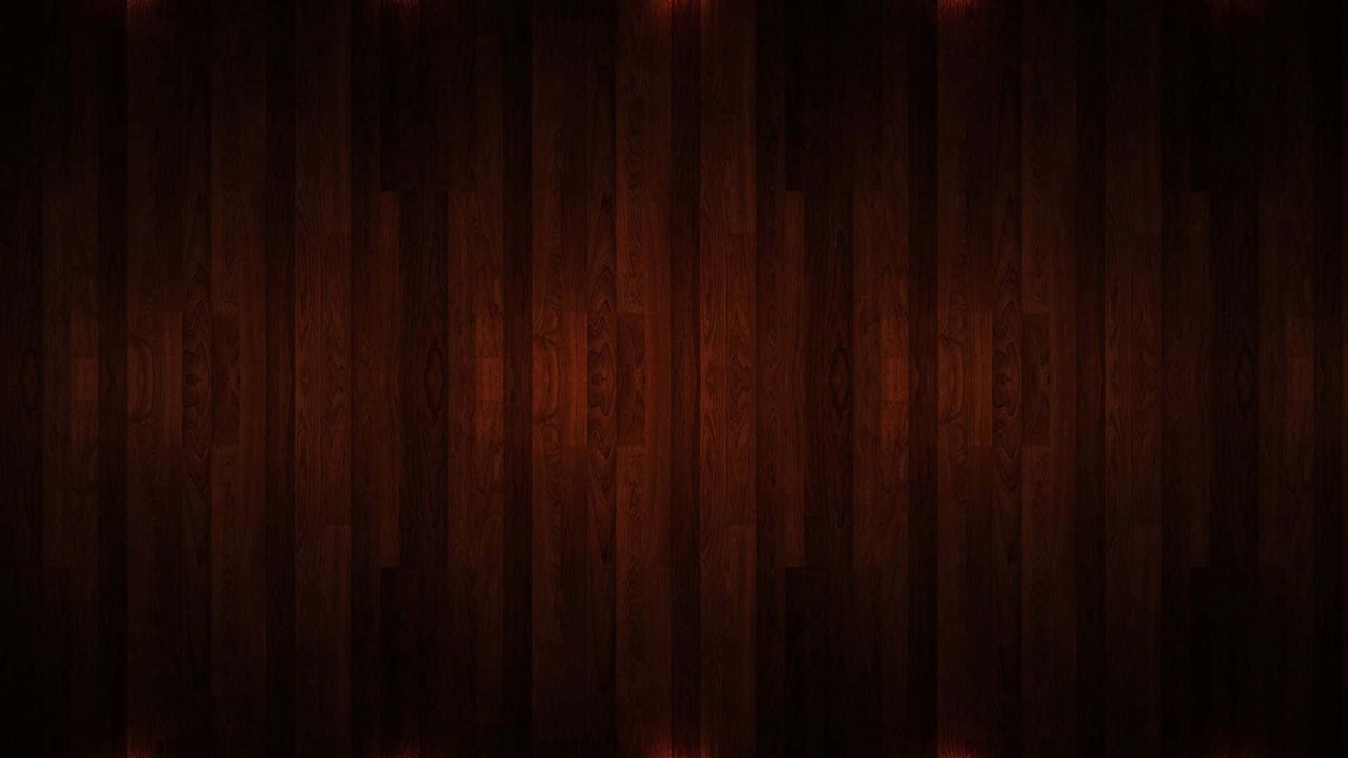 Mahogany 桌布 壁紙 — 豐富的深色木板帶有溫暖發光的高光，營造出舒適的紋理背景。
