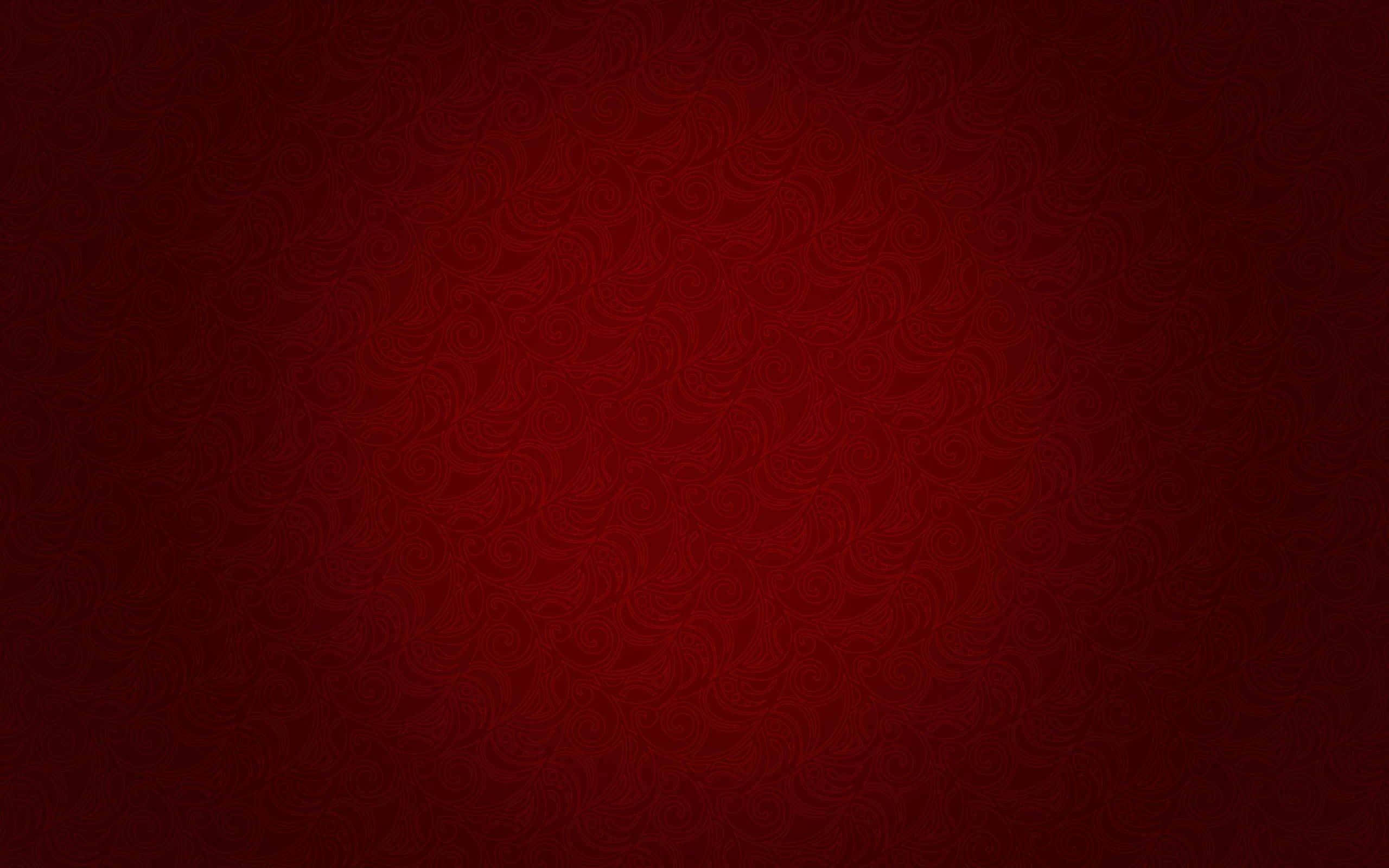 Gradient 桌布 壁紙 — 豐富的漸層紅色背景，帶有微妙的漩渦花卉圖案，從深酒紅色漸變到鮮豔的深紅色。