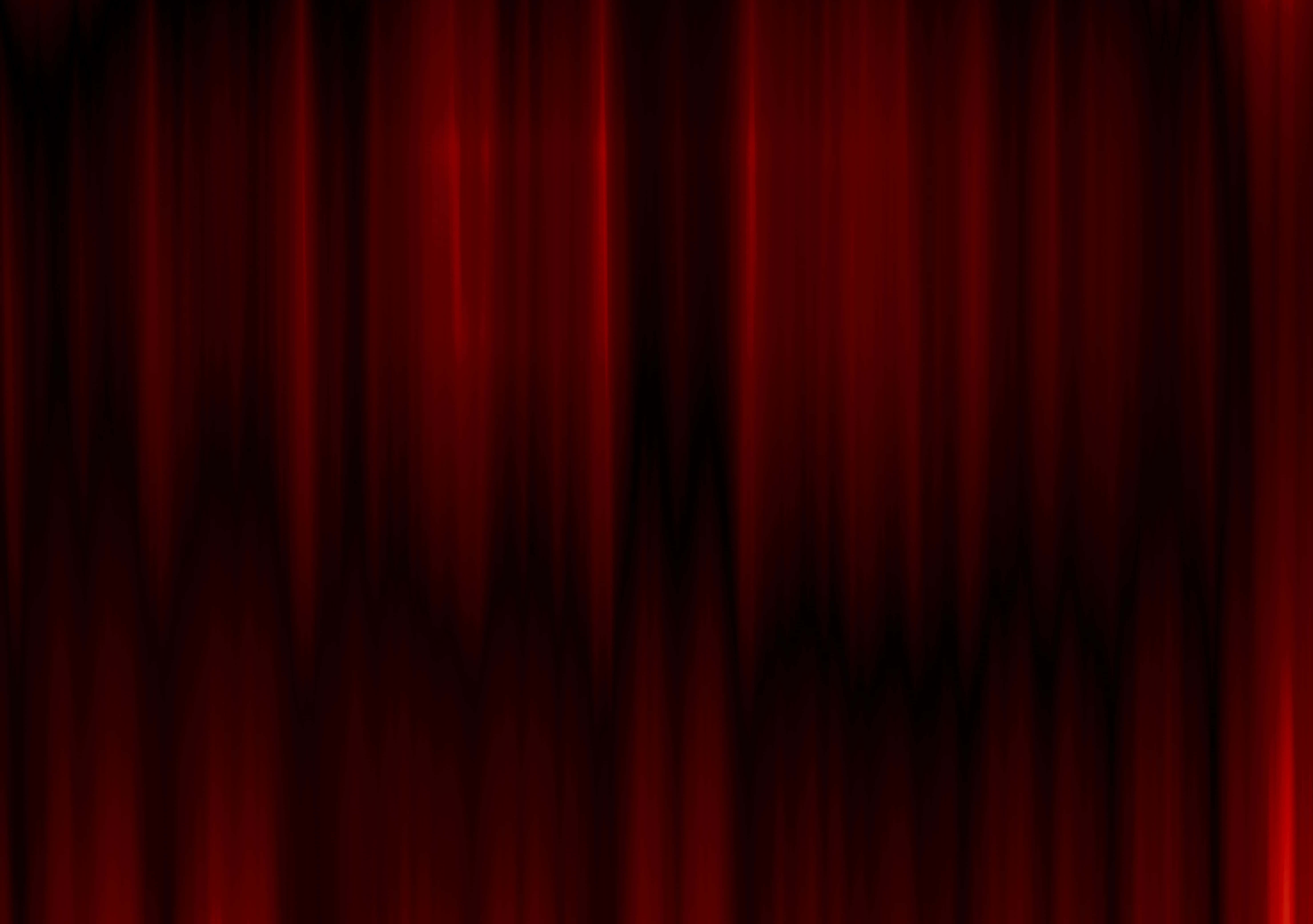 Dark Red Aesthetic 桌布 壁紙 — 豐富的紅色天鵝絨窗簾以深褶懸掛，戲劇性的燈光突顯其奢華質感。