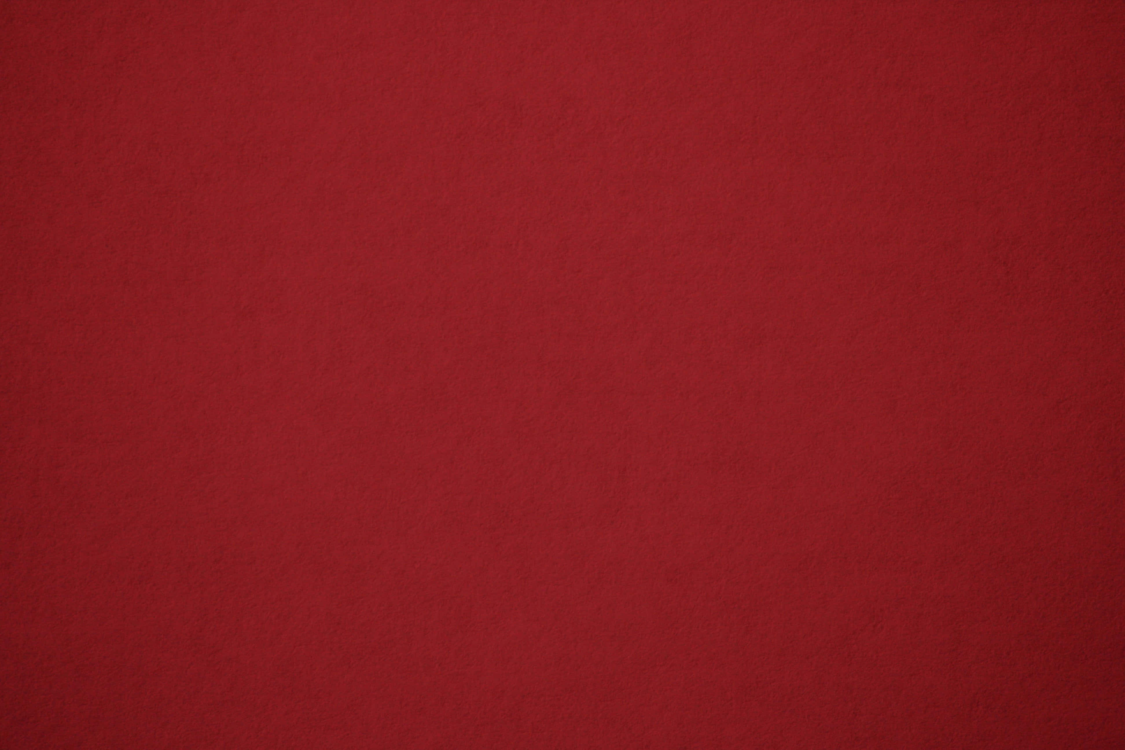 Red Texture 桌布 壁紙 — 豐富紋理的深紅色布料表面，色調和細微顆粒變化微妙。