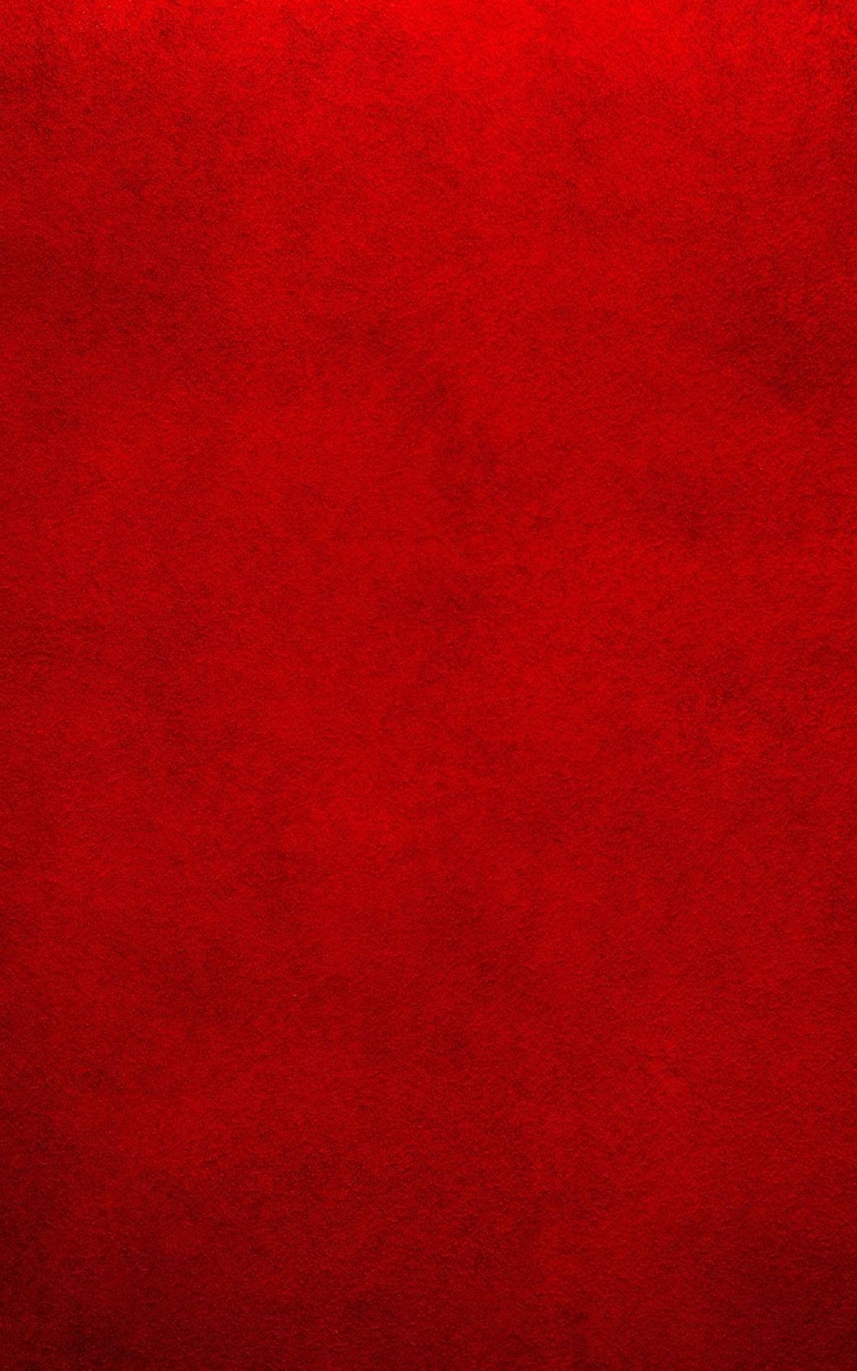 紅色 iPhone 桌布 壁紙 — 豐富紋理的紅色表面，色調和深度有細微變化。