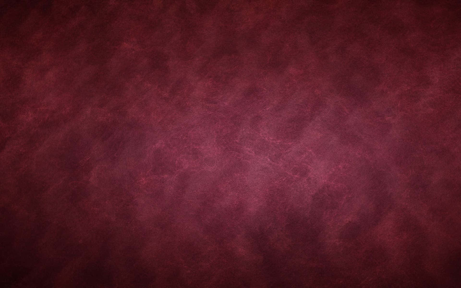 ripple 桌布 壁紙 — 豐富紋理的酒紅色表面，帶有細微漸層和有機圖案，營造出奢華的抽象背景。