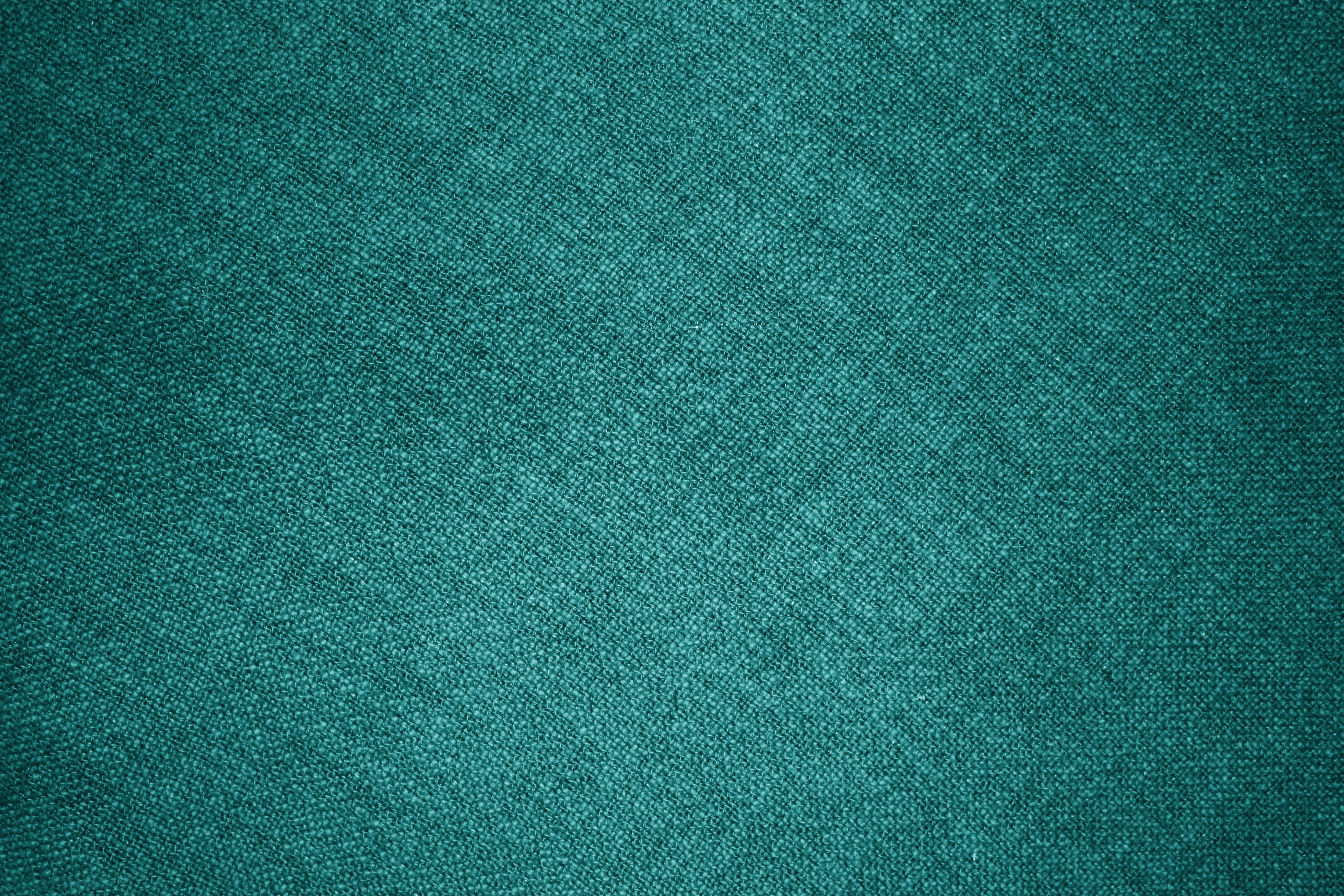 Fabric 桌布 壁紙 — 豐富青綠色織物的特寫，帶有微妙的編織紋理和柔和漸變燈光。