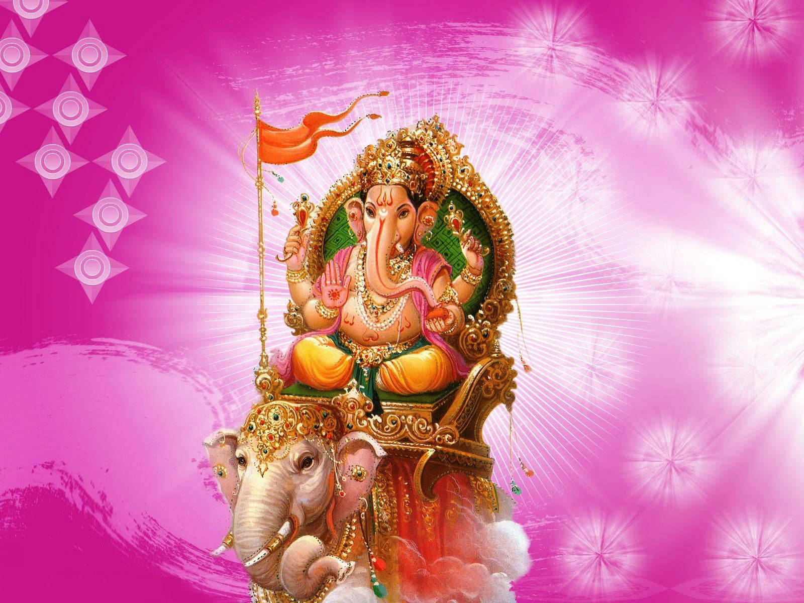 Ganesh 桌布 壁紙 — 象頭神甘尼許飾以黃金和珠寶，威嚴地坐在大象上，背景是帶有星爆圖案的耀眼粉紅色。